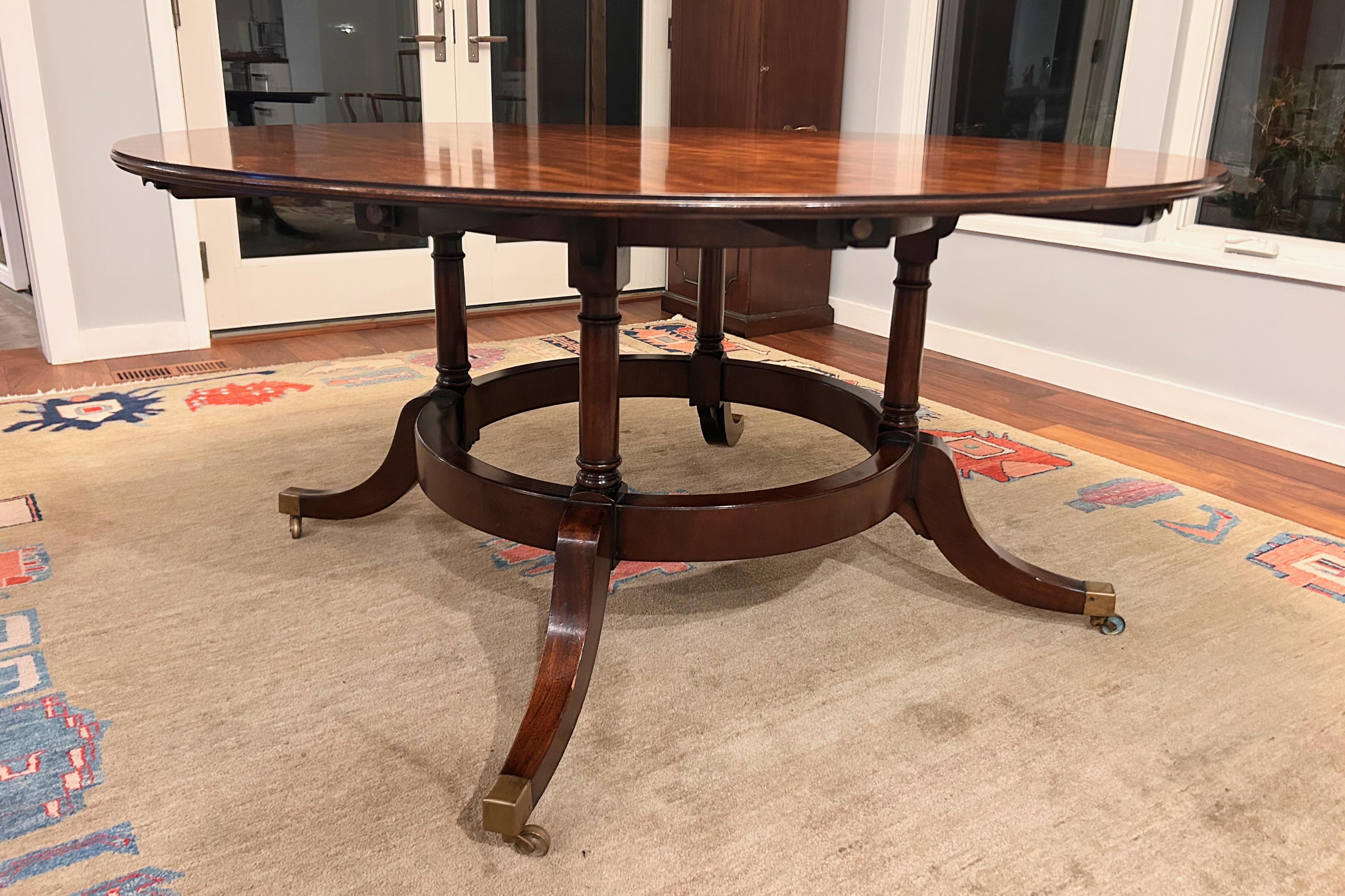 Hand-Crafted 1940's Round Mahogany Veneer Dining Table with Crescent Leaves and Leaf Cabinet For Sale