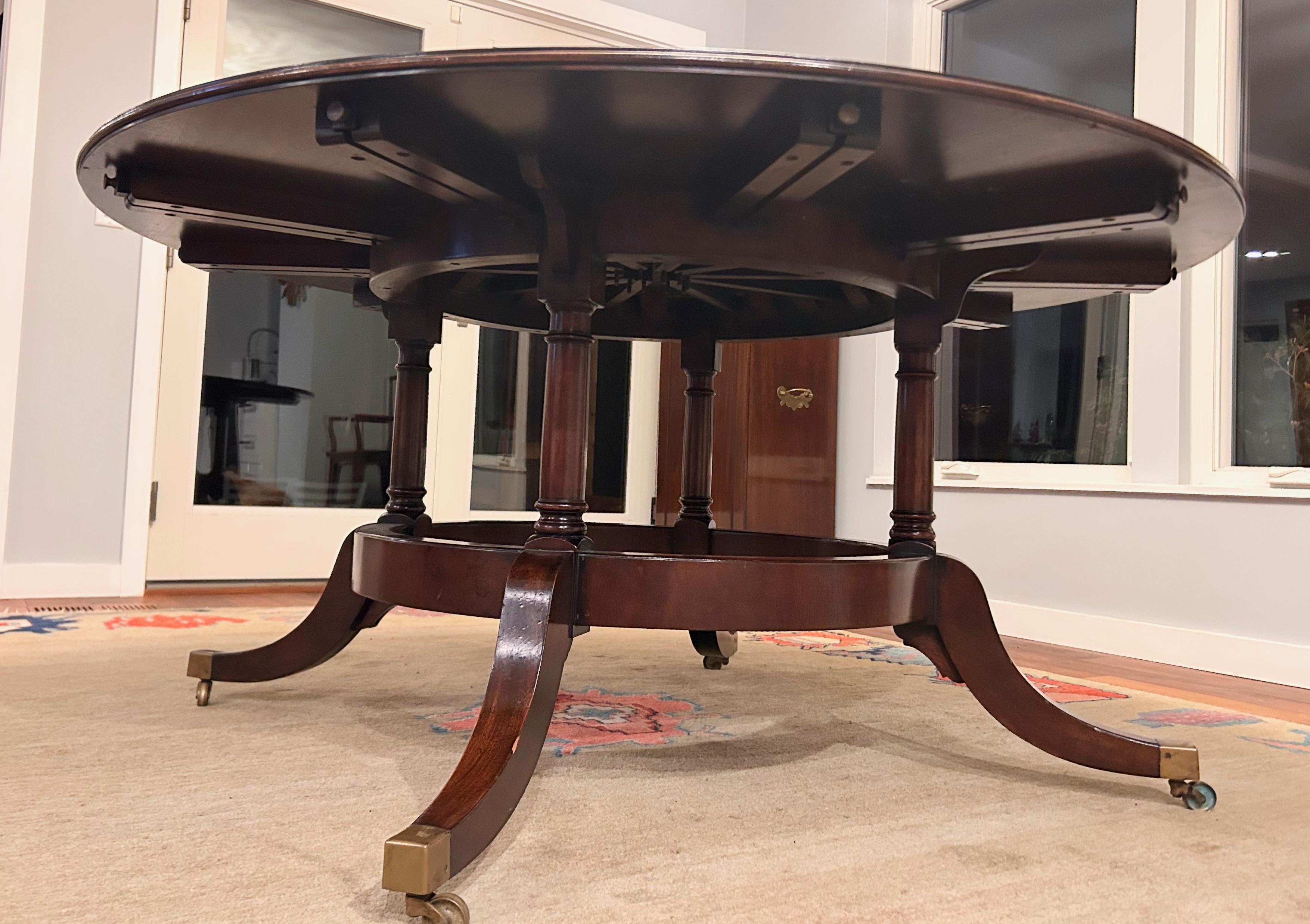1940's Round Mahogany Veneer Dining Table with Crescent Leaves and Leaf Cabinet In Good Condition For Sale In St Louis Park, MN