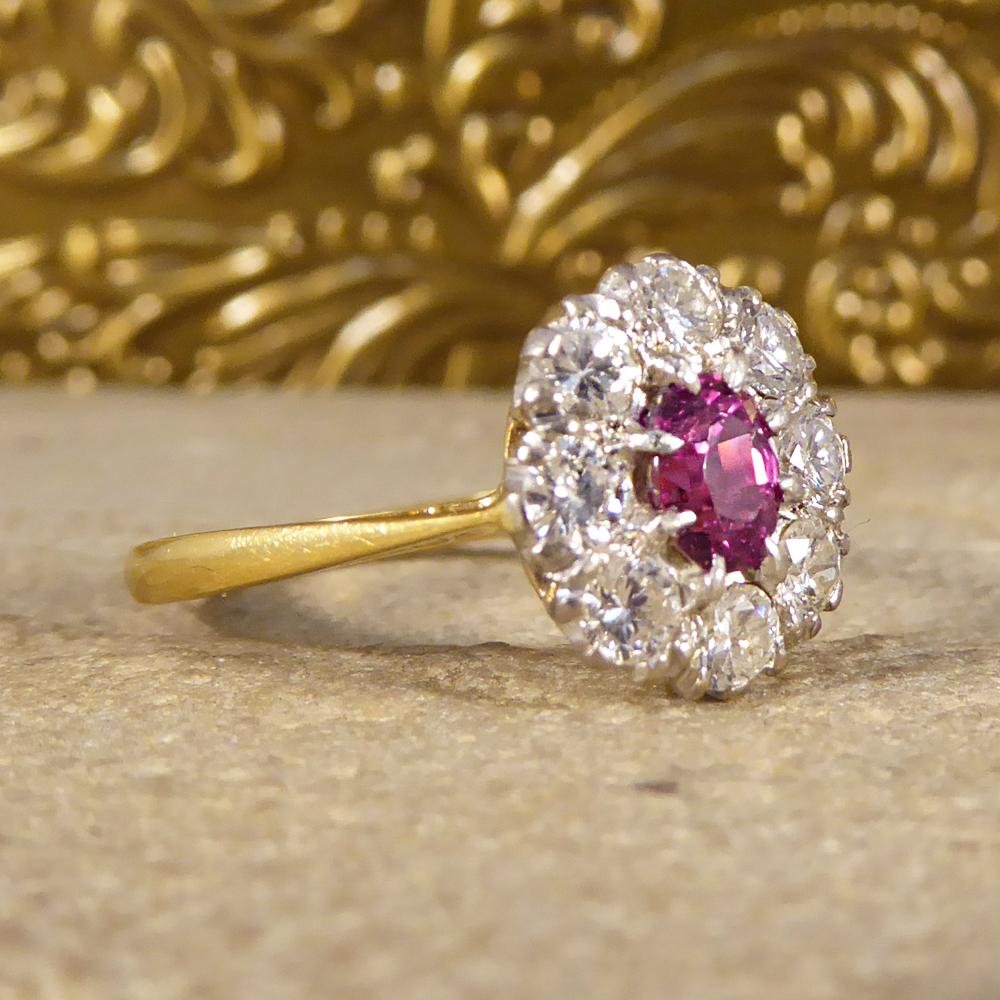 This 1940's Ruby and Diamond cluster Ring holds a 0.50ct Ruby gemstone in the centre with eight round brilliant cut Diamonds surrounding it. The head has been crafted in 18ct White Gold to compliment the stones in a secure claw setting and leading