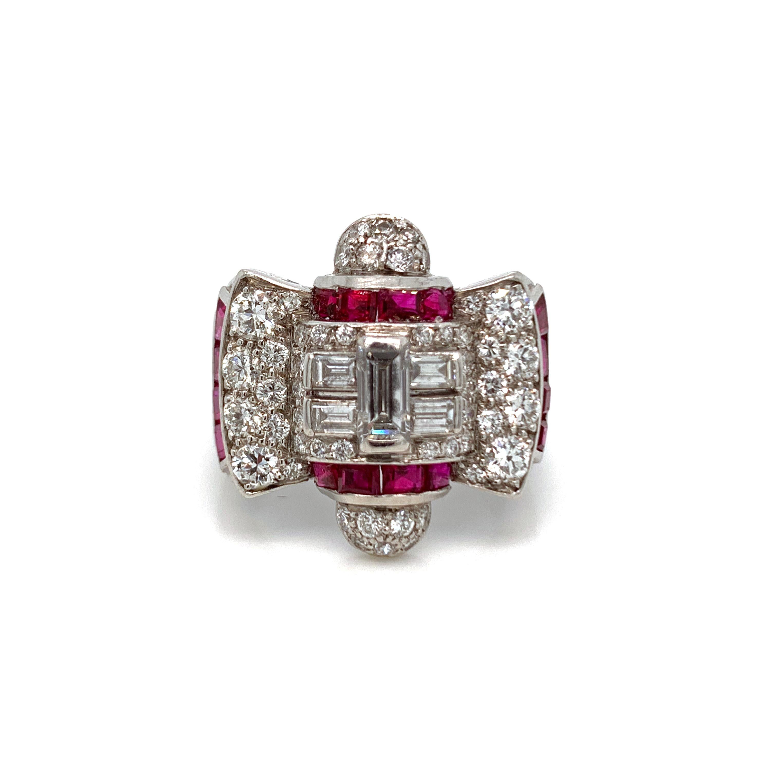A beautiful diamond ring from the 1940's. This, lovely diamond and ruby ring is a US ring size 5.25 and weighs 10.3 grams. Crafted, in platinum the ring features round and baguette cut diamonds. The, ring also features Rubies, in the center and