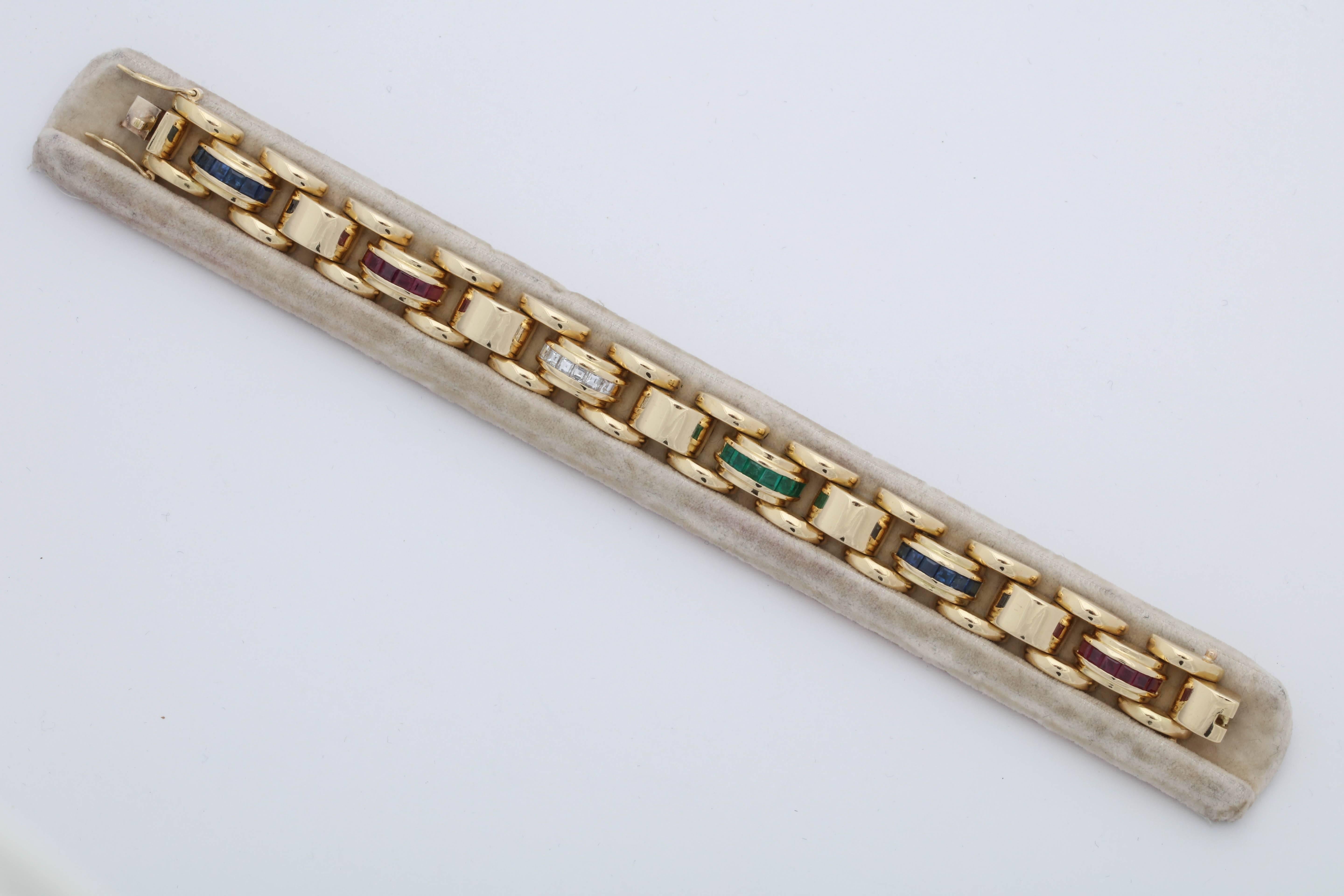 One Ladies 18kt Yellow Gold Heavy Link Bracelet Embellished With Eight Custom Cut Calibre Cut Emeralds Weighing Approx. 75 Carat Total weight And Further Designed with Eight Custom Cut Calibre Cut Sapphires Weighing approximately .75 Carat Total