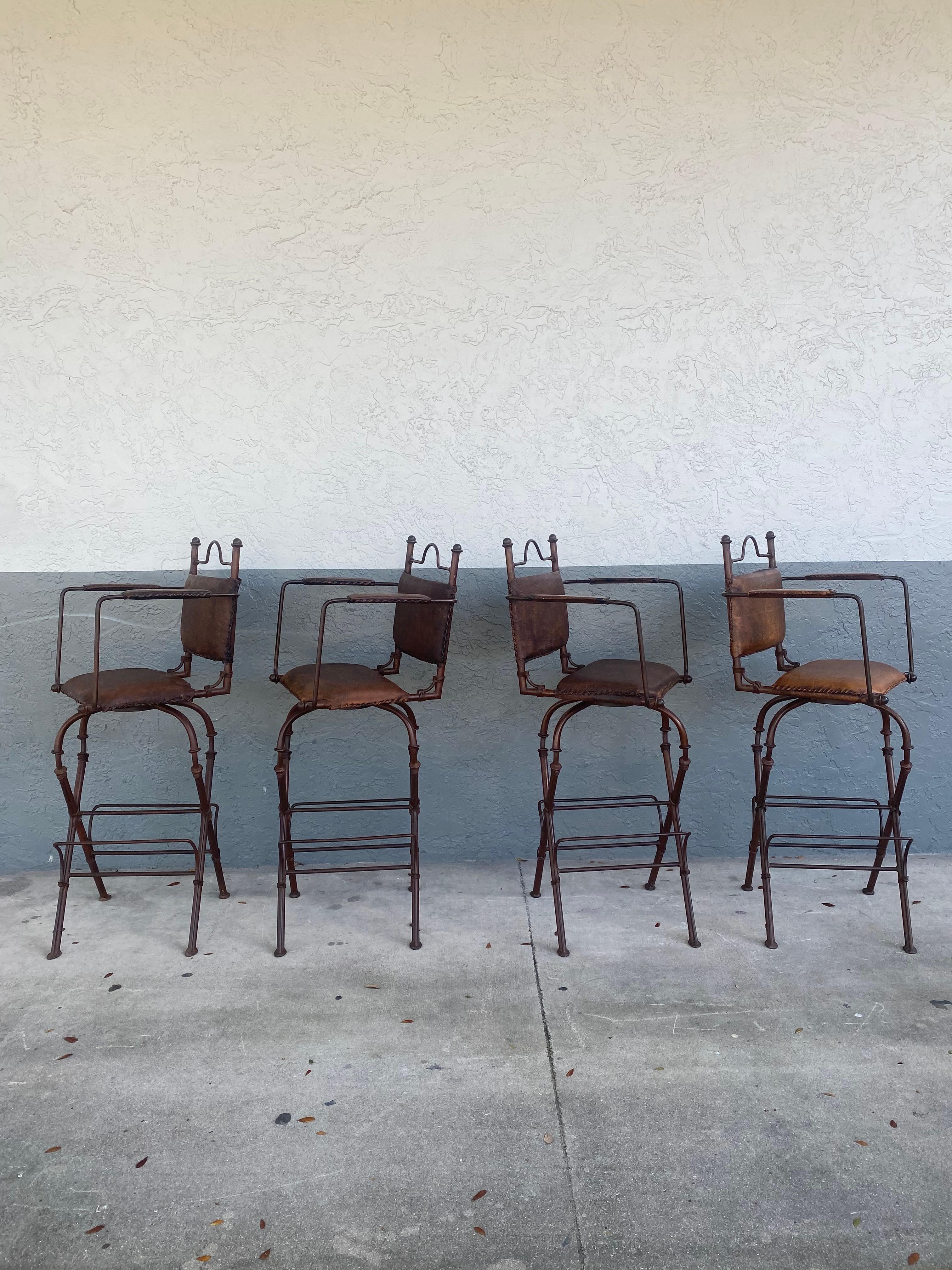 1940s Rustic Industrial Iron and Buffalo Leather Swivel Stools, Set of 4 In Good Condition For Sale In Fort Lauderdale, FL
