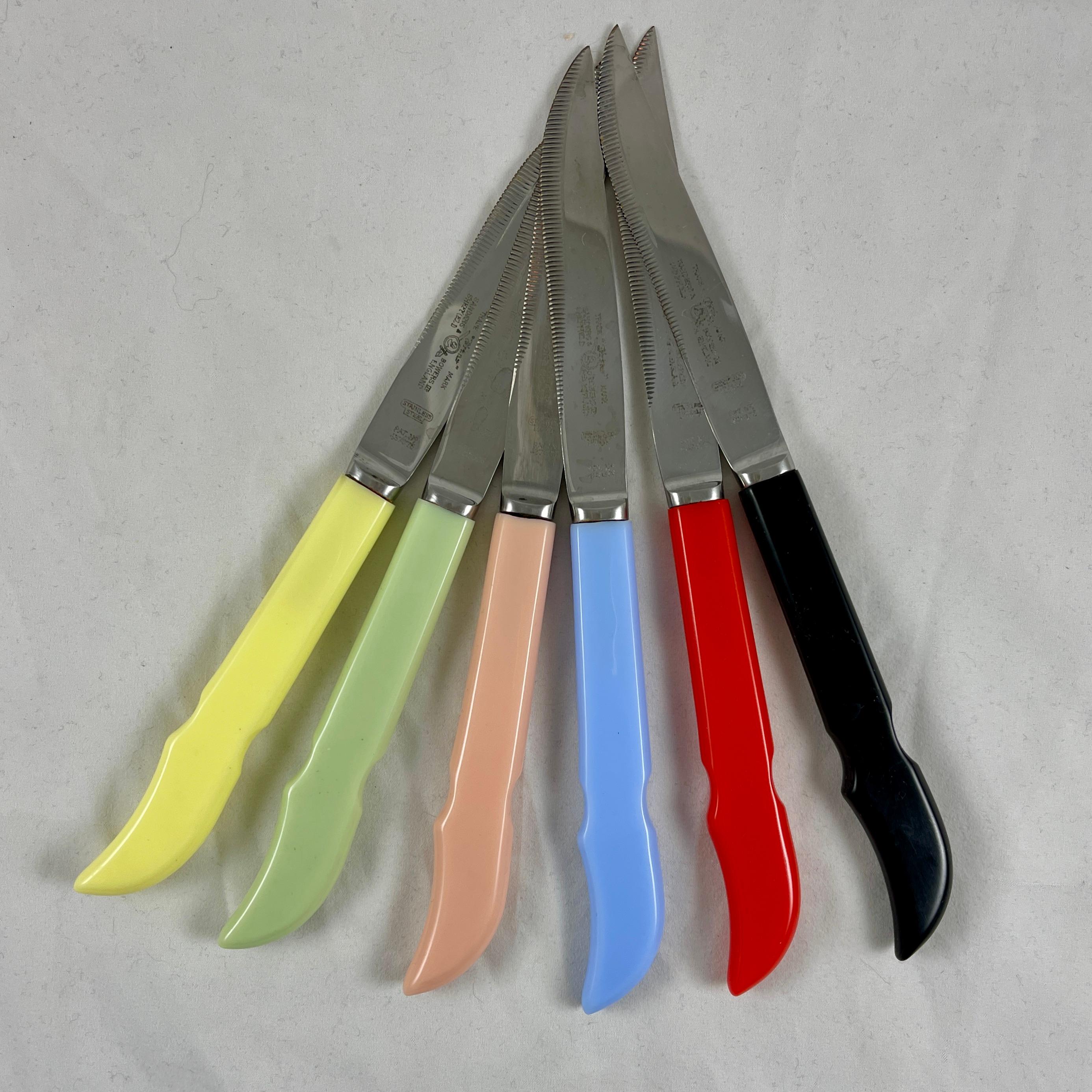 A boxed set of six Sanders and Bowers rainbow colored Bakelite handled steak knives, Sheffield, England, circa early 1940s.

Multi-colored shaped handles made of Bakelite are fitted to serrated Stainless Steel blades. Still in the original
