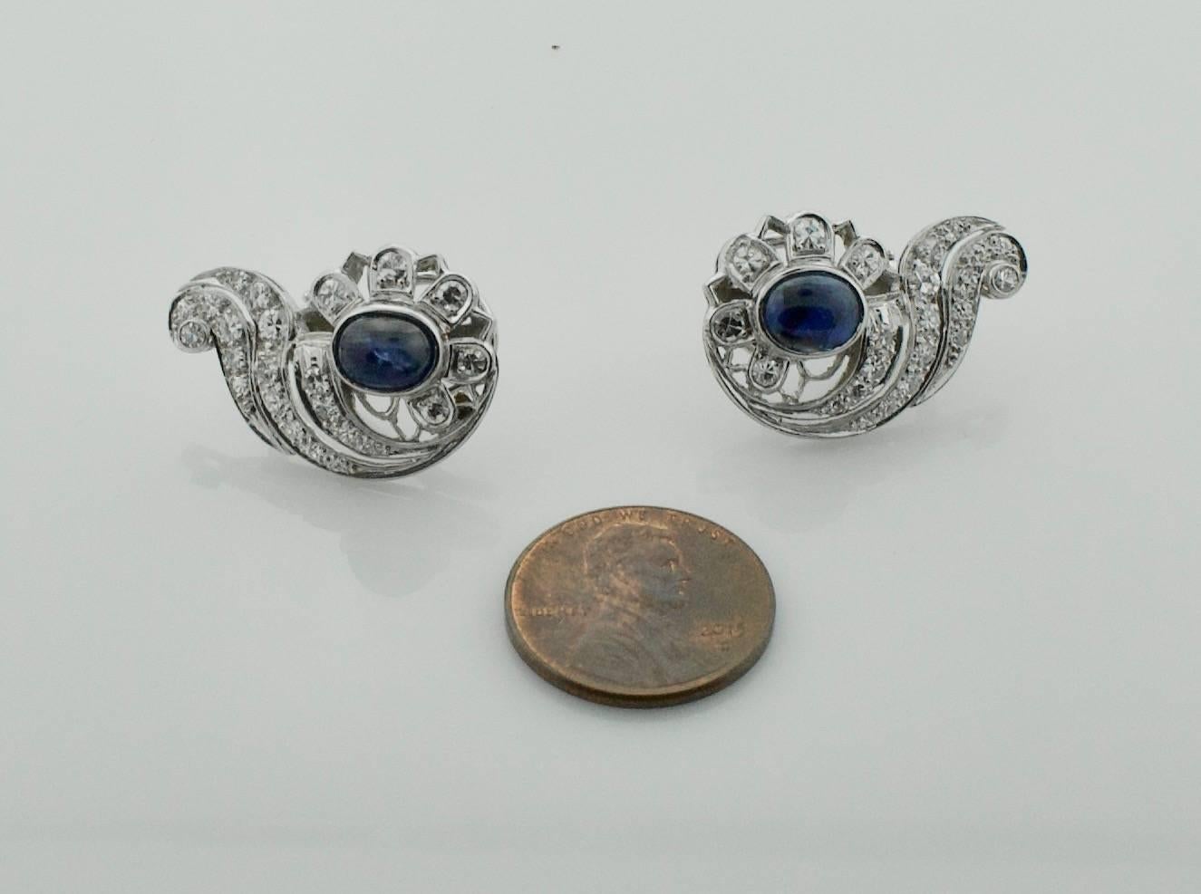 1940's Sapphire and Diamond Earrings
Handmade.  A Left and Right.  Can be worn either way.
Two Oval Cabochon Sapphire weighing 5.00 carats approximately 
Forty Eight Round Cut Diamonds weighing 1.70 carats approximately 
Comfortable, Collectable and