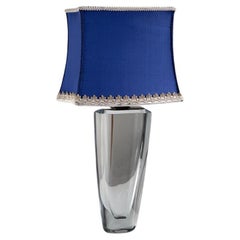 1940s Scandinavian Glass lamp with brass top and a blue vintage raw silk shade.