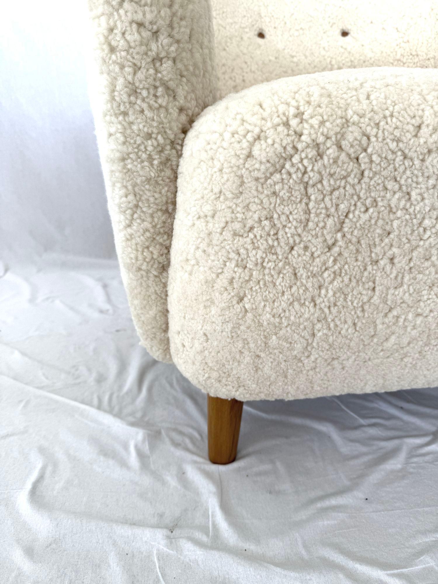 1940's Scandinavian Sheepskin Lounge Chair. Feet are Birch. New Sheepskin Upholstery.