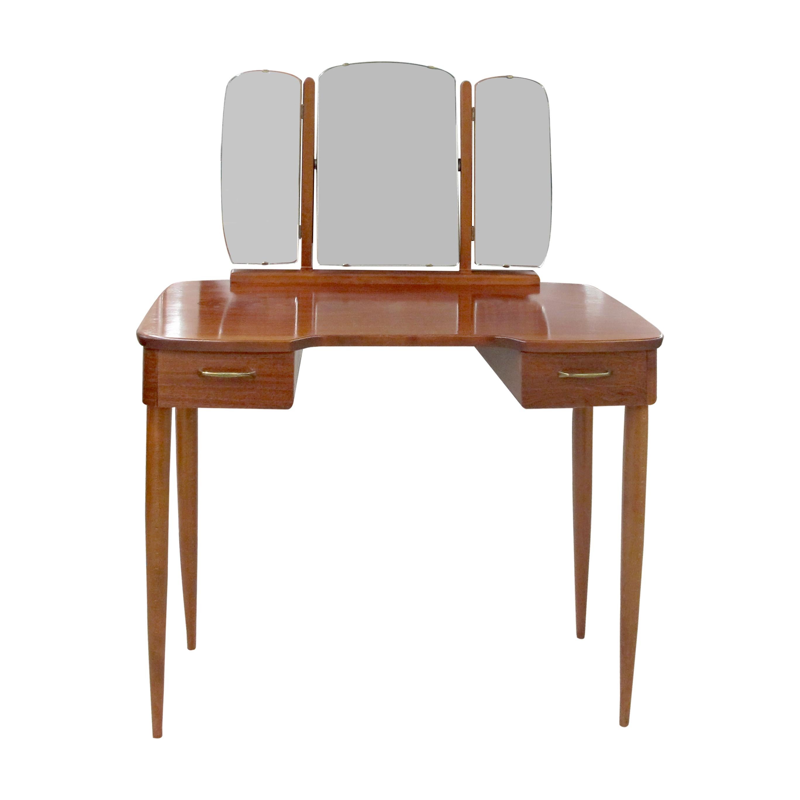 This is a classic Swedish dressing table/vanity table from the 1930s/40s, showcasing the timeless elegance of Scandinavian design.  The dressing table features a distinctive curved tabletop that is complemented by its original triptych mirror, which