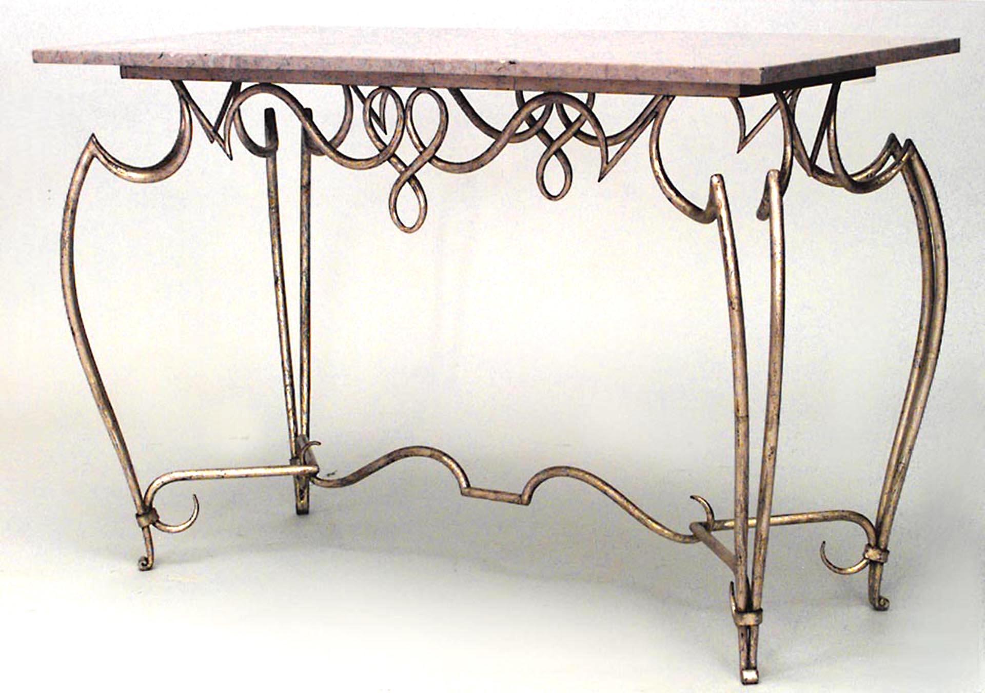 French 1940s gold painted iron center table with rectangular beige marble top above scrolling apron & legs joined by a stretcher (attributed to RENE PROU)
