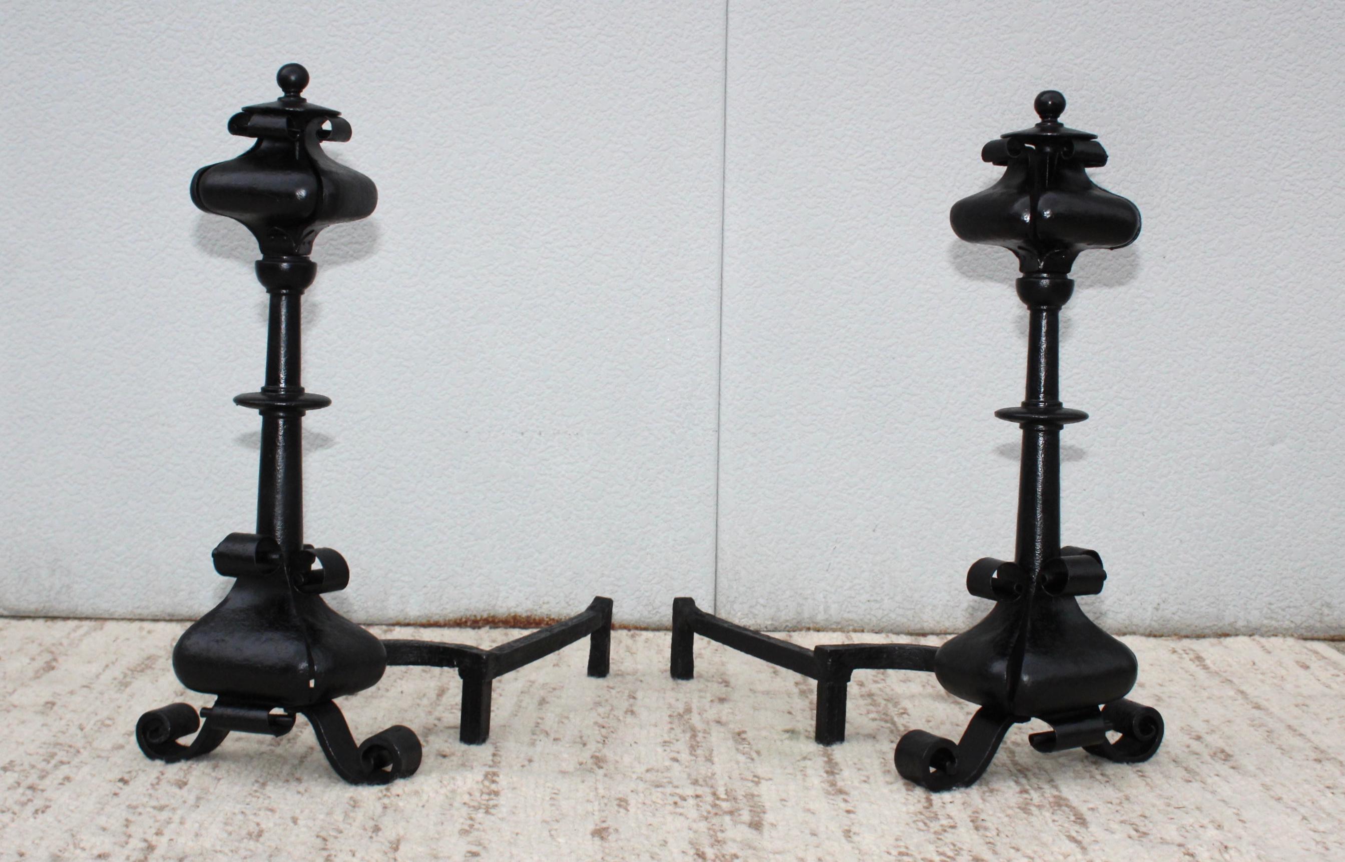 1940s large scrolled iron andirons, newly painted with some wear and patina due to age and use.