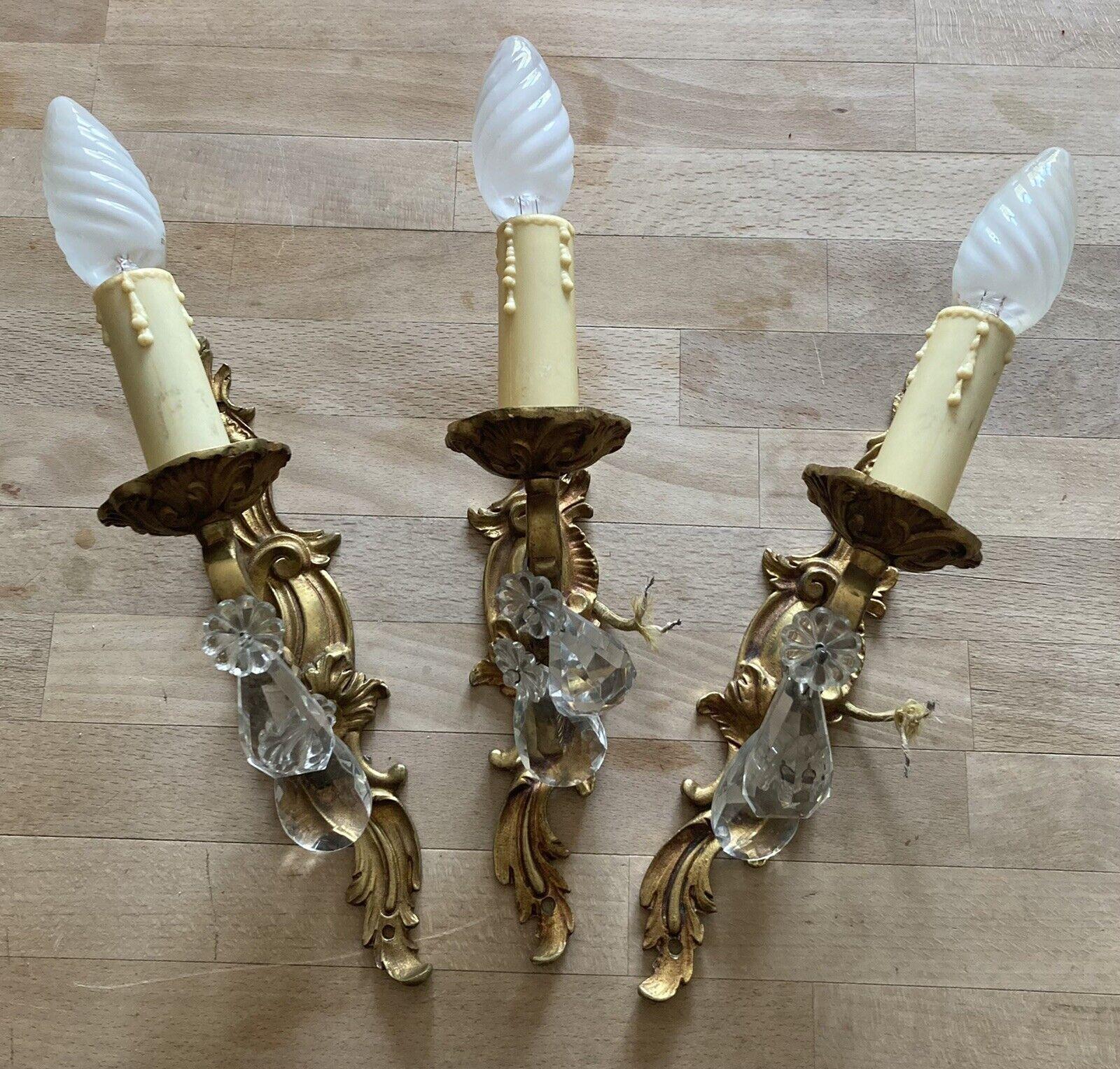 Set of 3 1940's French Louis XVI Rococo style Gilt Bronze Wall Sconces with Cut Crystal. Single bulb on each sconce.
