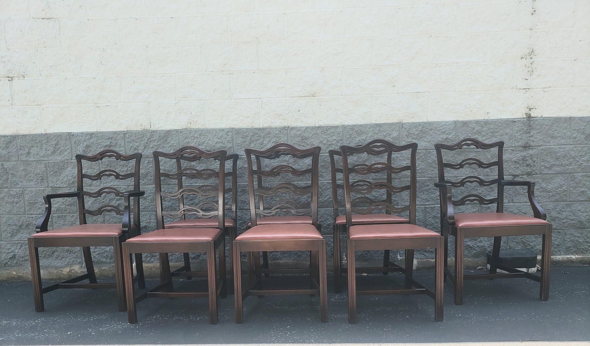 Beaitiful Set of 8 Mahogany Chippendale Pierced Ladder Back and Faux Leather upholstered Seat Dining Chairs. Six side chairs and 2 captain chairs. Measures 21.5