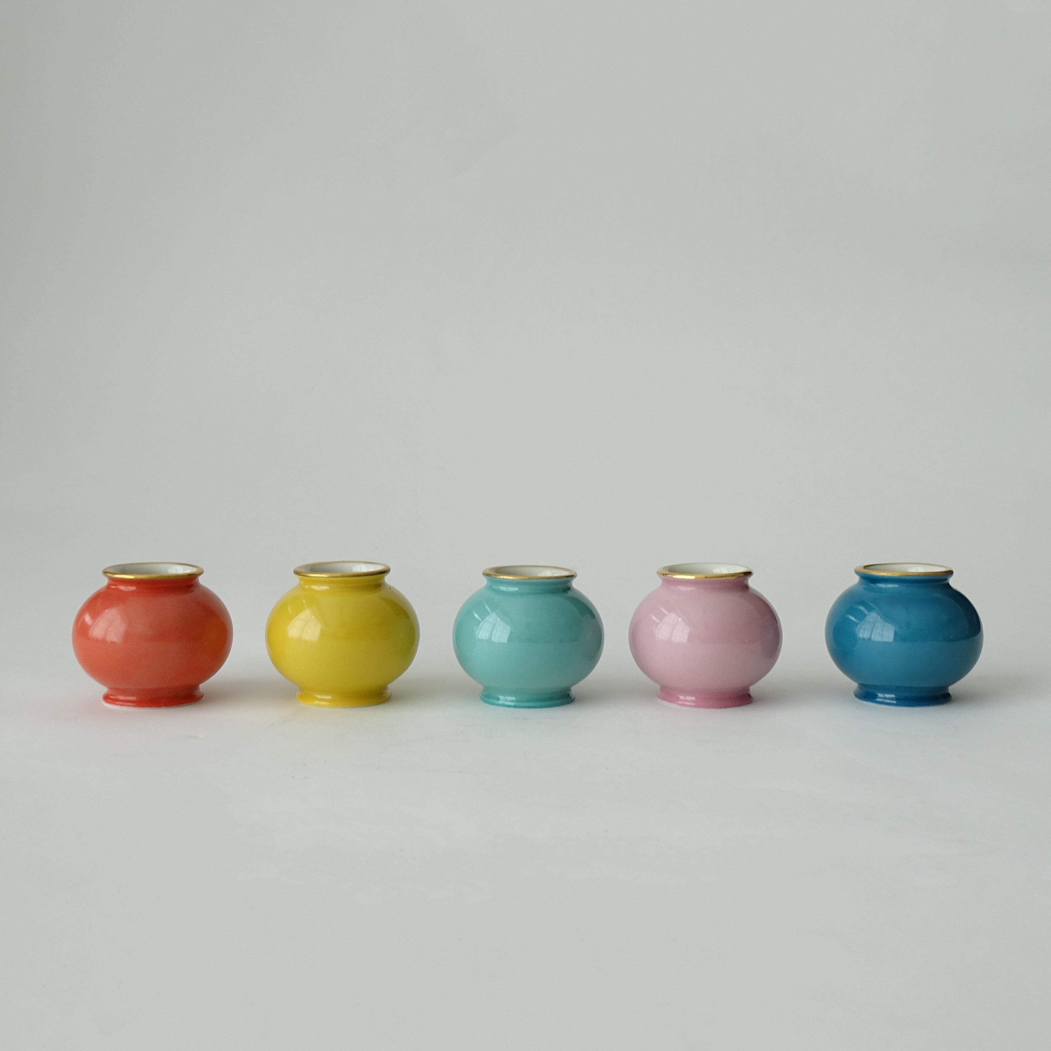 A splendid set of small 1940s Five Pastel Colored Soliflor Porcelain Vases, 
For great table settings. 
These are New, Old Stock in their original packaging.
Ten multi-colored sets are available