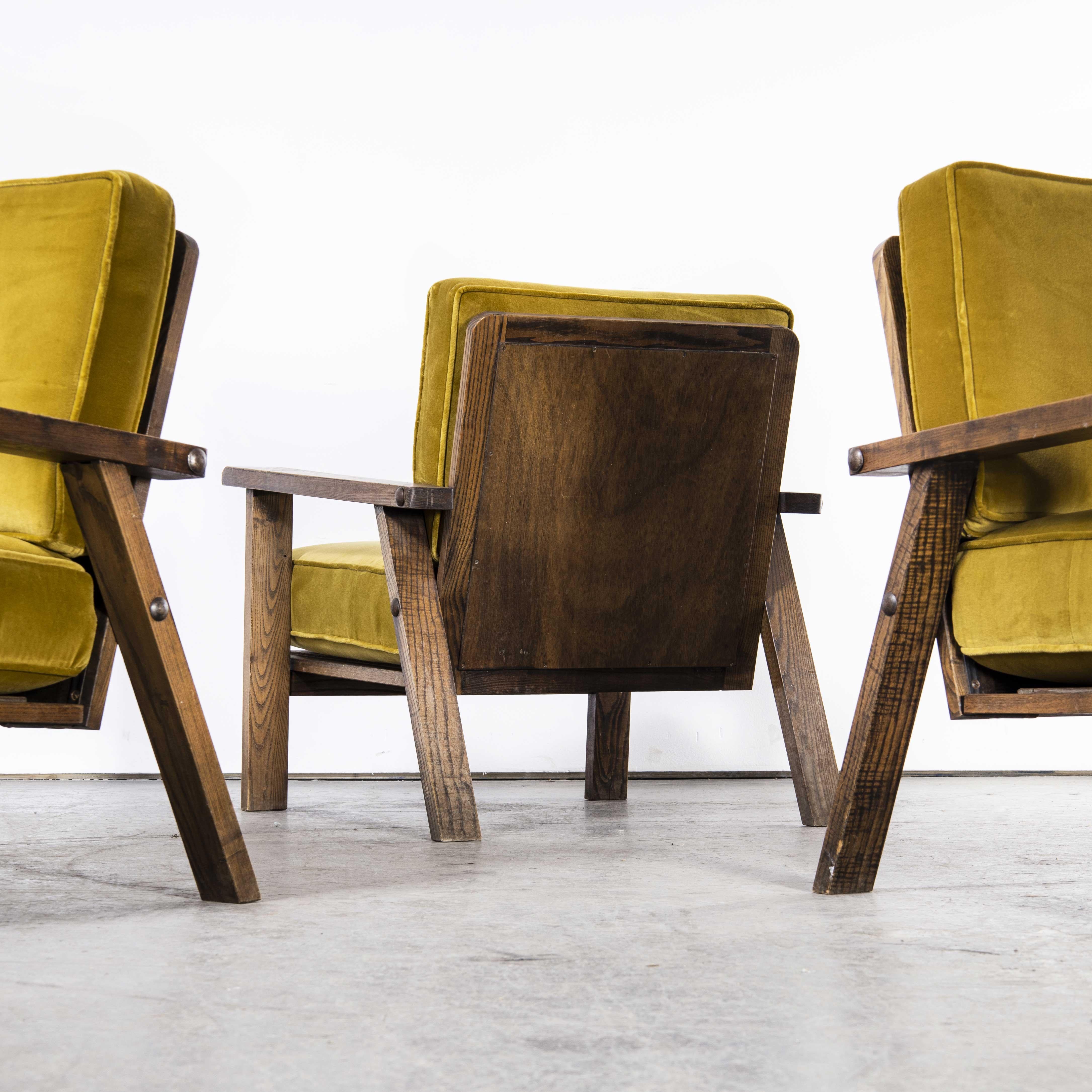 1940’s set of three upholstered french armchairs – mustard

1940’s set of three upholstered french armchairs – mustard. Superb set of three low upholstered armchairs from France. Made in solid oak the armchairs have a lovely low proportion with