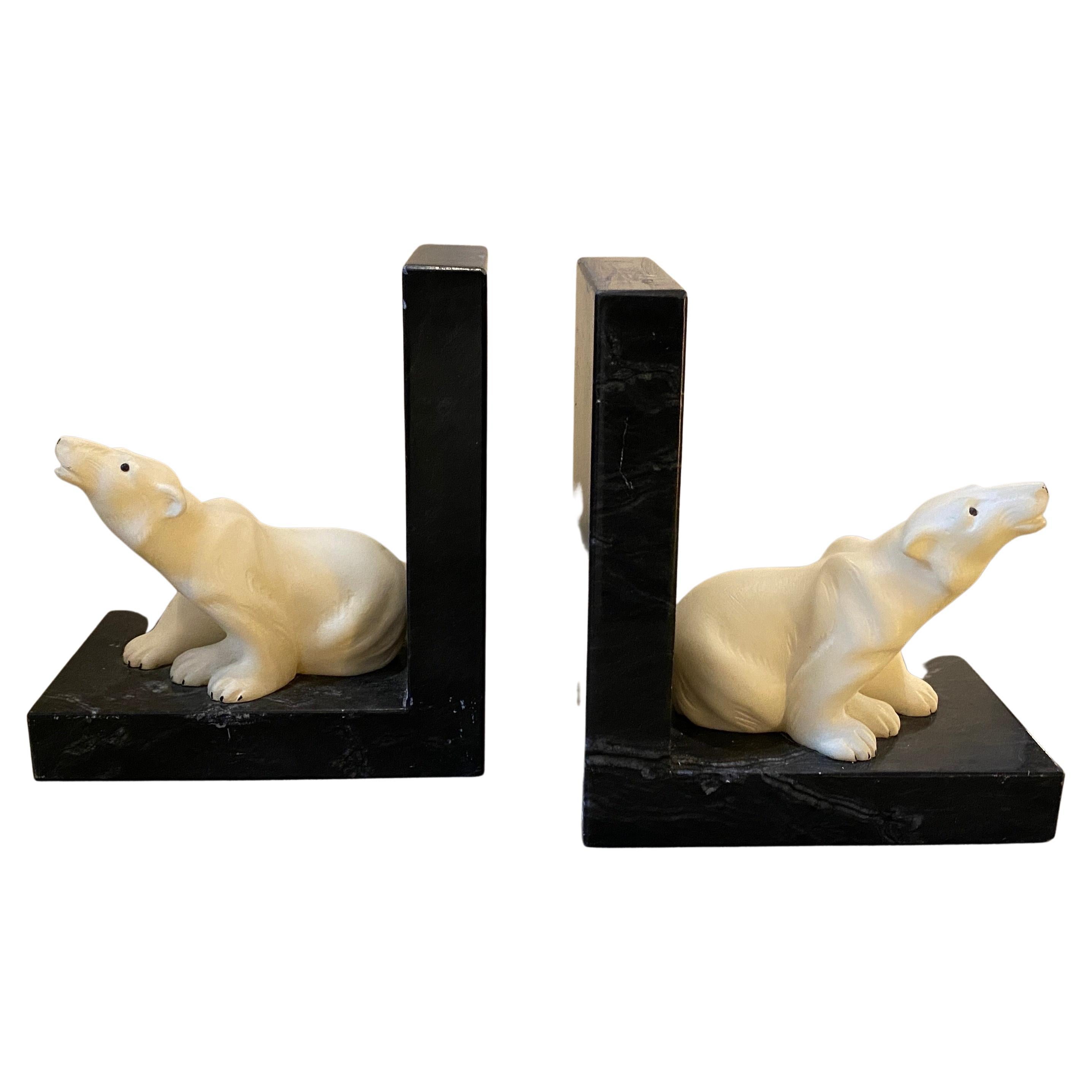 A pair of art deco marble bookends manufactured in Italy in the Forties. On the black marble base there are a marble white polar orse, the two bookends are in good conditions overall.
