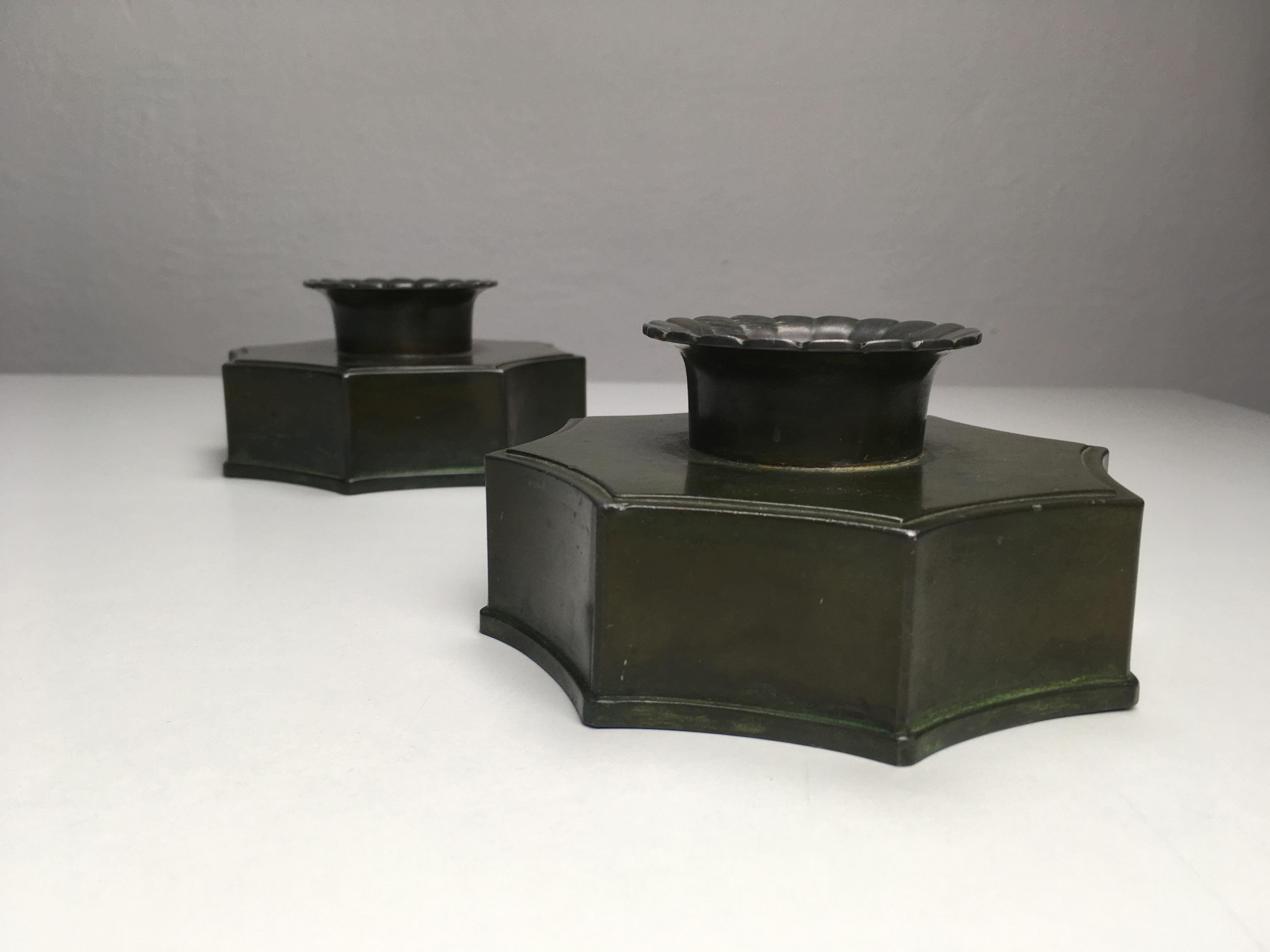 Set of two Danish Just Andersen disco metal candle holders produced by Just Andersen A/S in the 1940's.

The candle holders are in good vintage condition and marked with Just. Andersens triangle mark. 

Just Andersen 1884-1943 was born in
