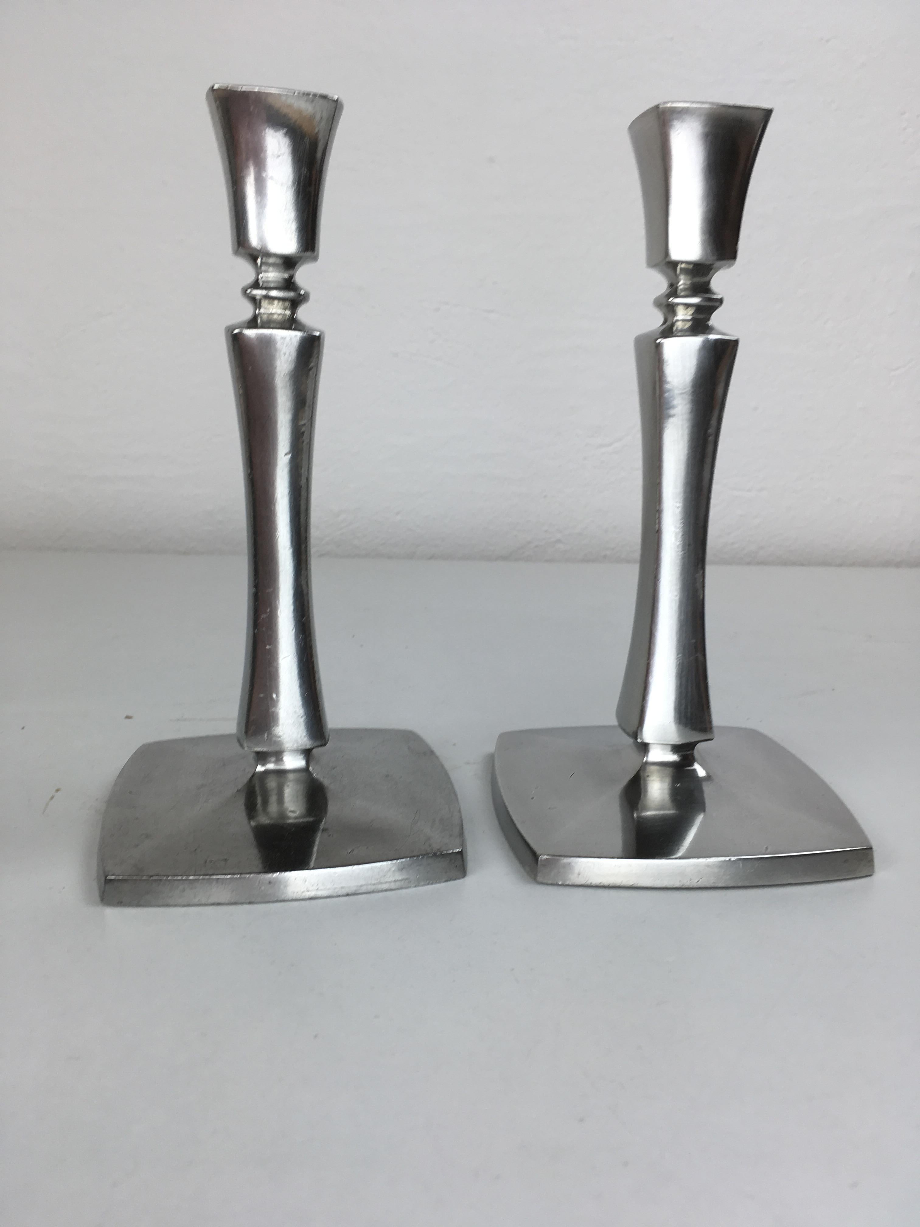 Set of two Danish Just Andersen pewter candle holders produced by Just Andersen A/S in the 1940's.

The well designed candle holders are in good vintage condition and marked with Just. Andersens triangle mark. 

Just Andersen 1884-1943 was born
