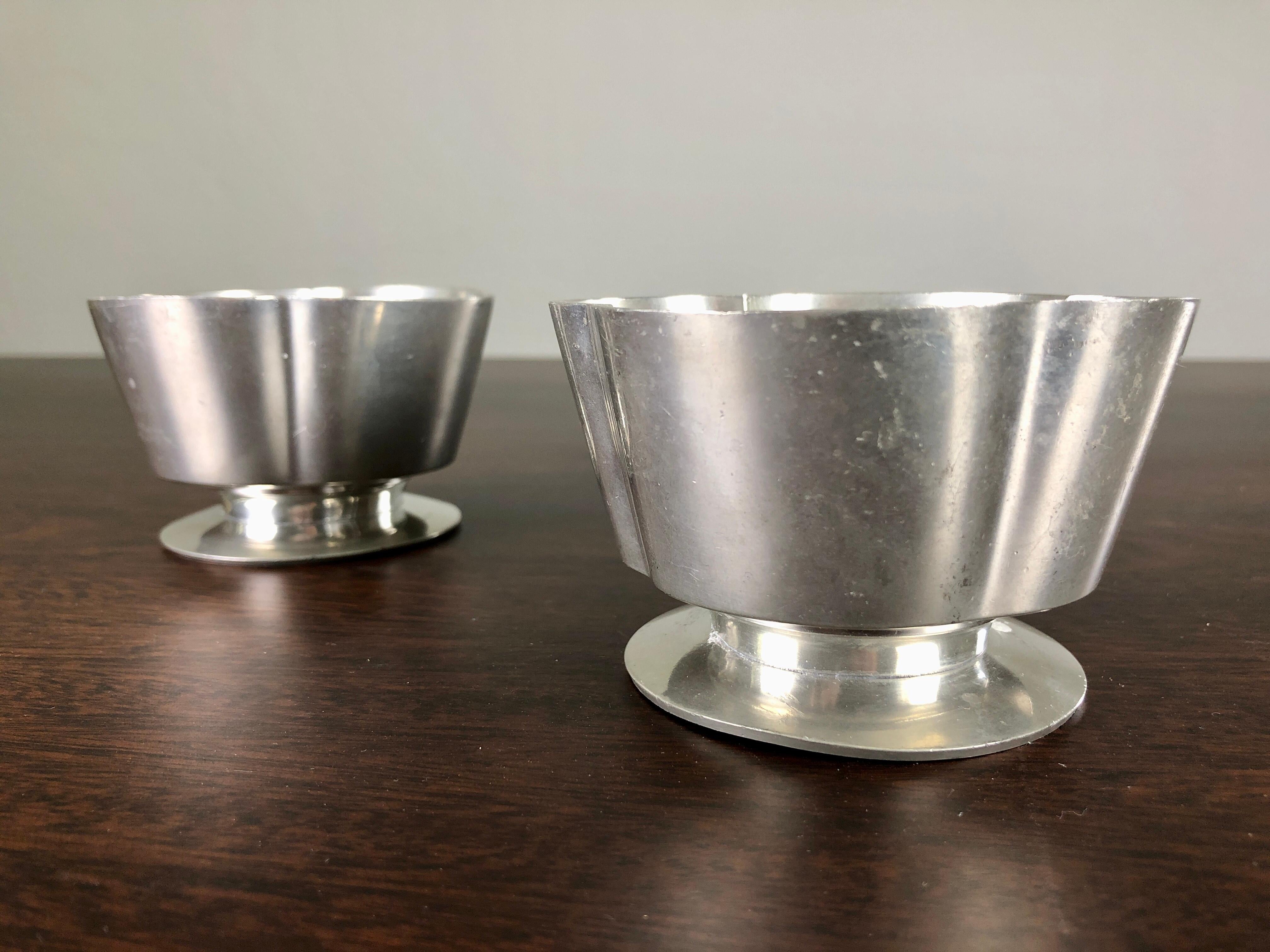 Set of two Danish Just Andersen art deco pewter candlesticks produced by Just Andersen A/S in the 1930´s / 1940´s

The candle holders are in good vintage condition and marked with Just. Andersens triangle mark. 

Just Andersen 1884-1943 was born