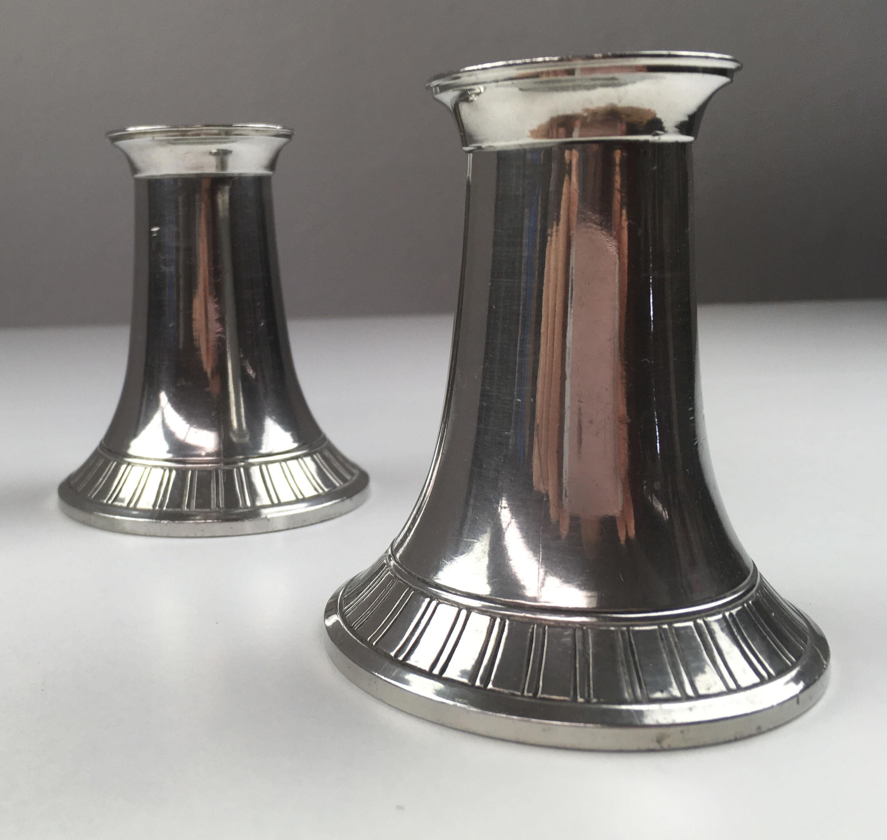 Set of two Danish Just Andersen mid century candle holders produced by Just Andersen A/S in the 1940 - 1950´s.

The candle holders are in good vintage condition and marked with Just. Andersens triangle mark. 

Just Andersen 1884-1943 was born in