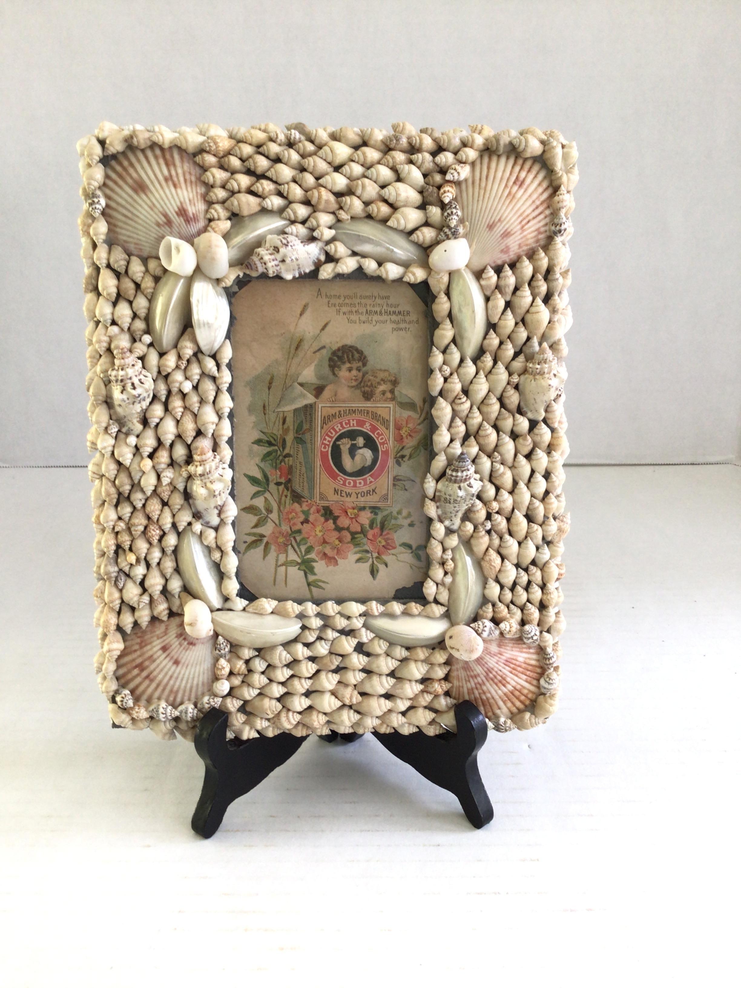1940s Shell Picture Frame (with glass)
Shell with crack in it (as shown)
Stand not sold with frame
Hinged arm missing from back of frame