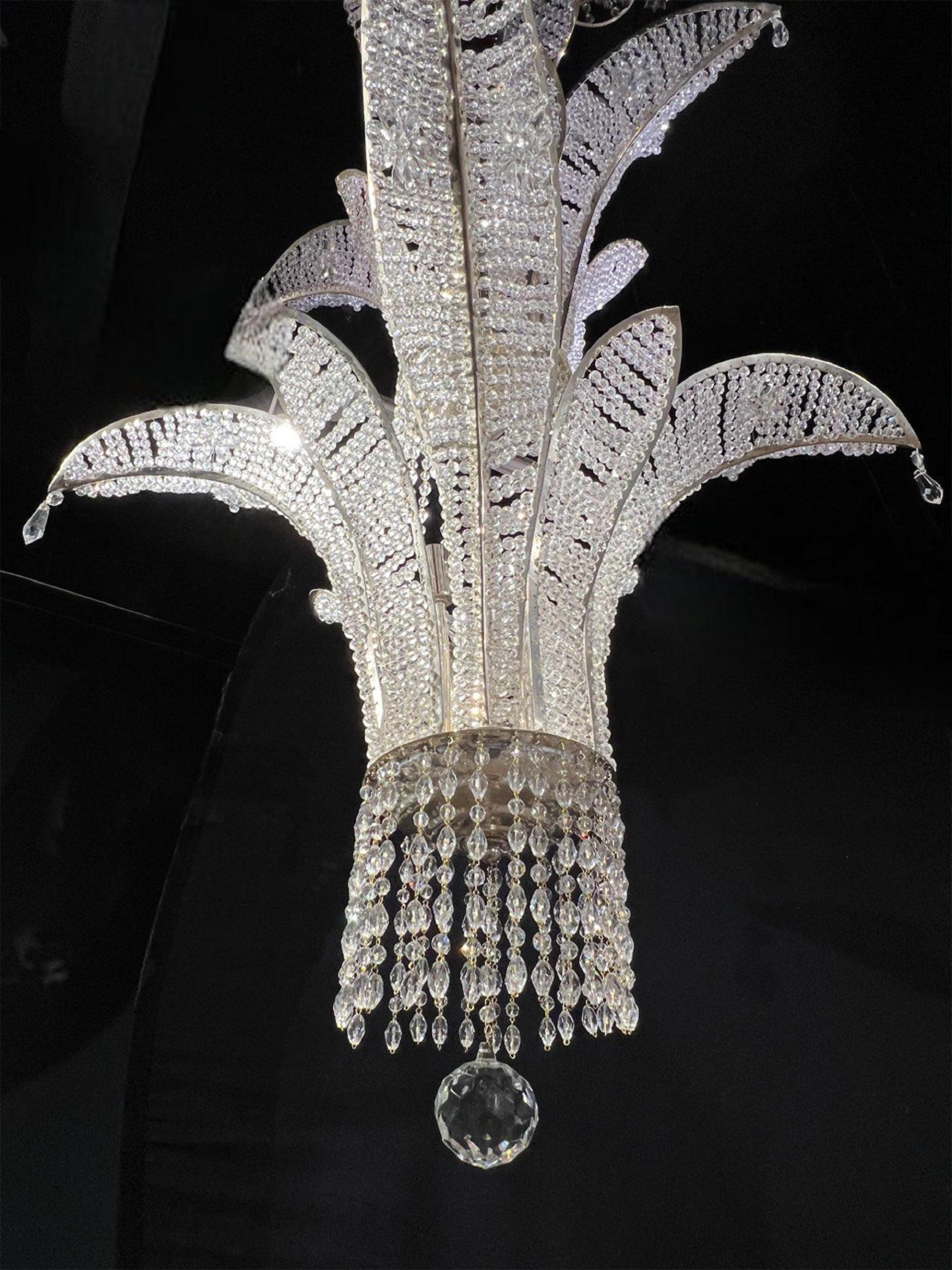 A circa 1940’s French silver plated chandelier with beaded crystals and 20 interior lights 