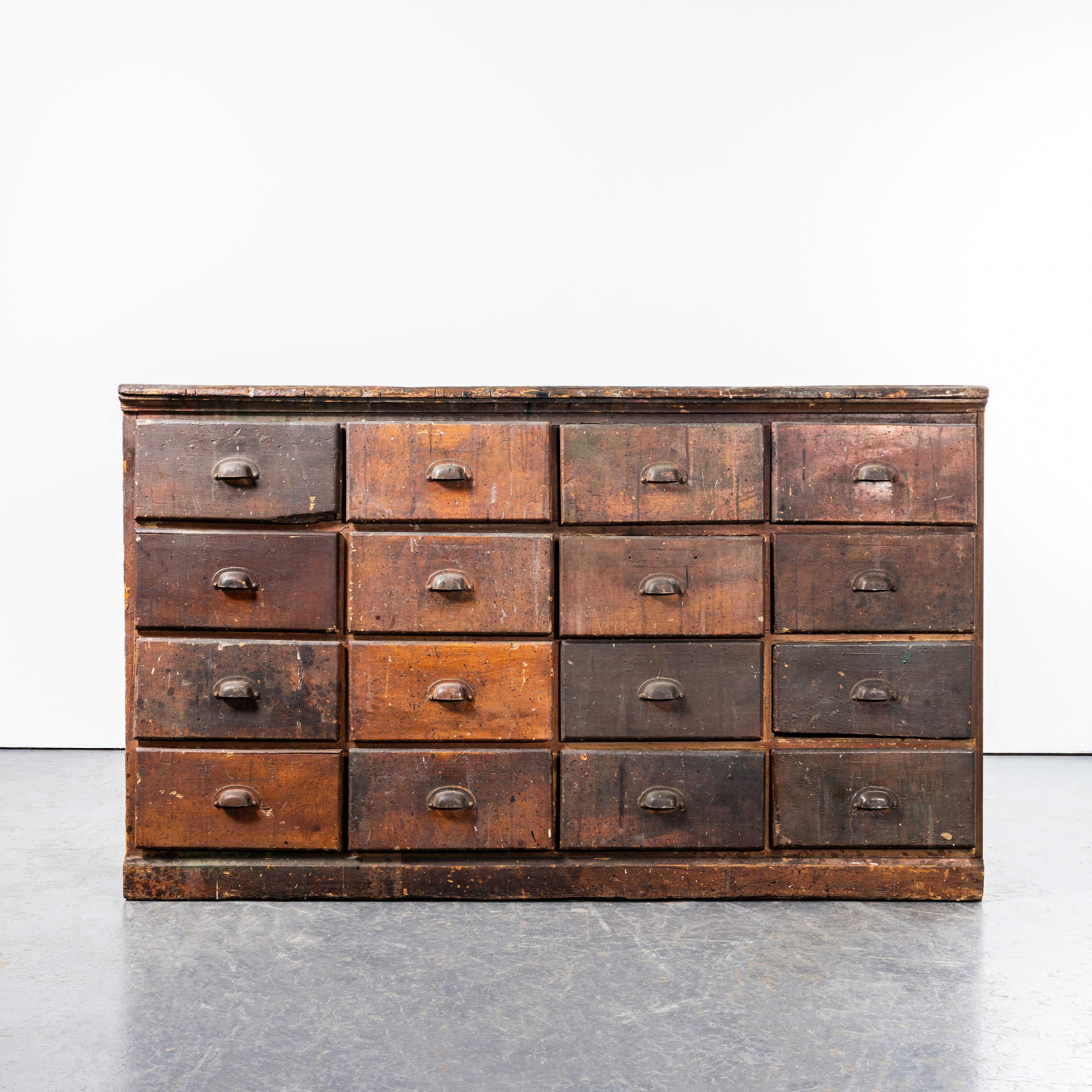 1940’s Solid Pitch Pine French Merchants Bank Of Drawers – Sixteen Drawers. 
One of the most characterful pieces we have come across in our travels. Originally the drawers were from a hardware merchants, the practical drawer size and labels