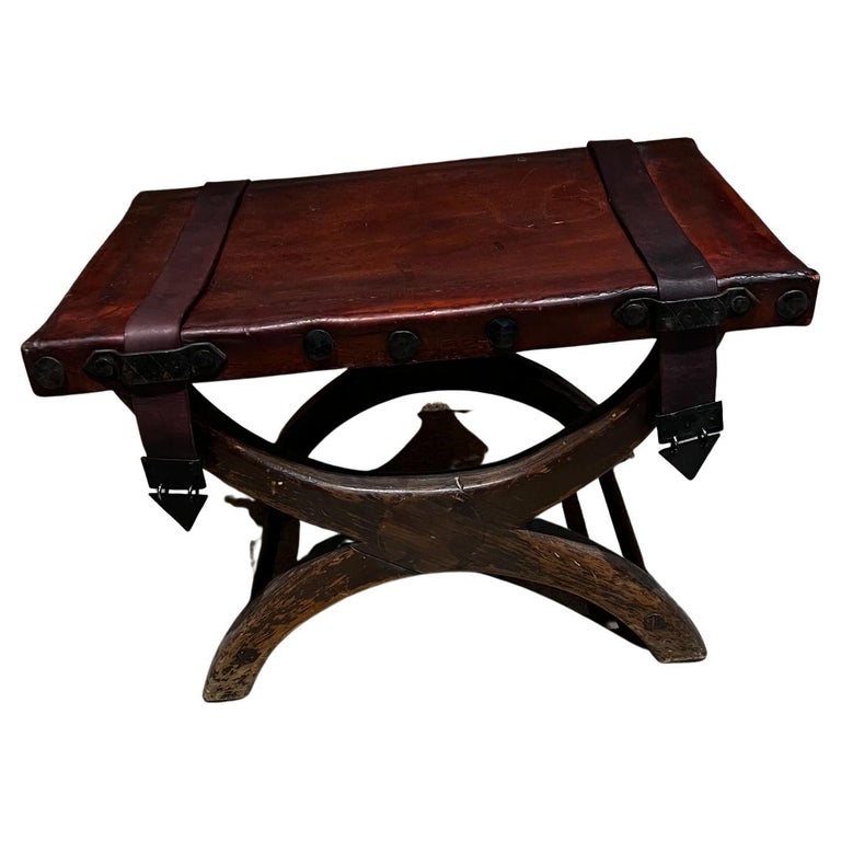 https://a.1stdibscdn.com/1940s-spanish-colonial-curule-miguelito-medallion-stool-leather-and-mahogany-for-sale/f_9715/f_304123421678982838798/f_30412342_1678982839233_bg_processed.jpg?width=768