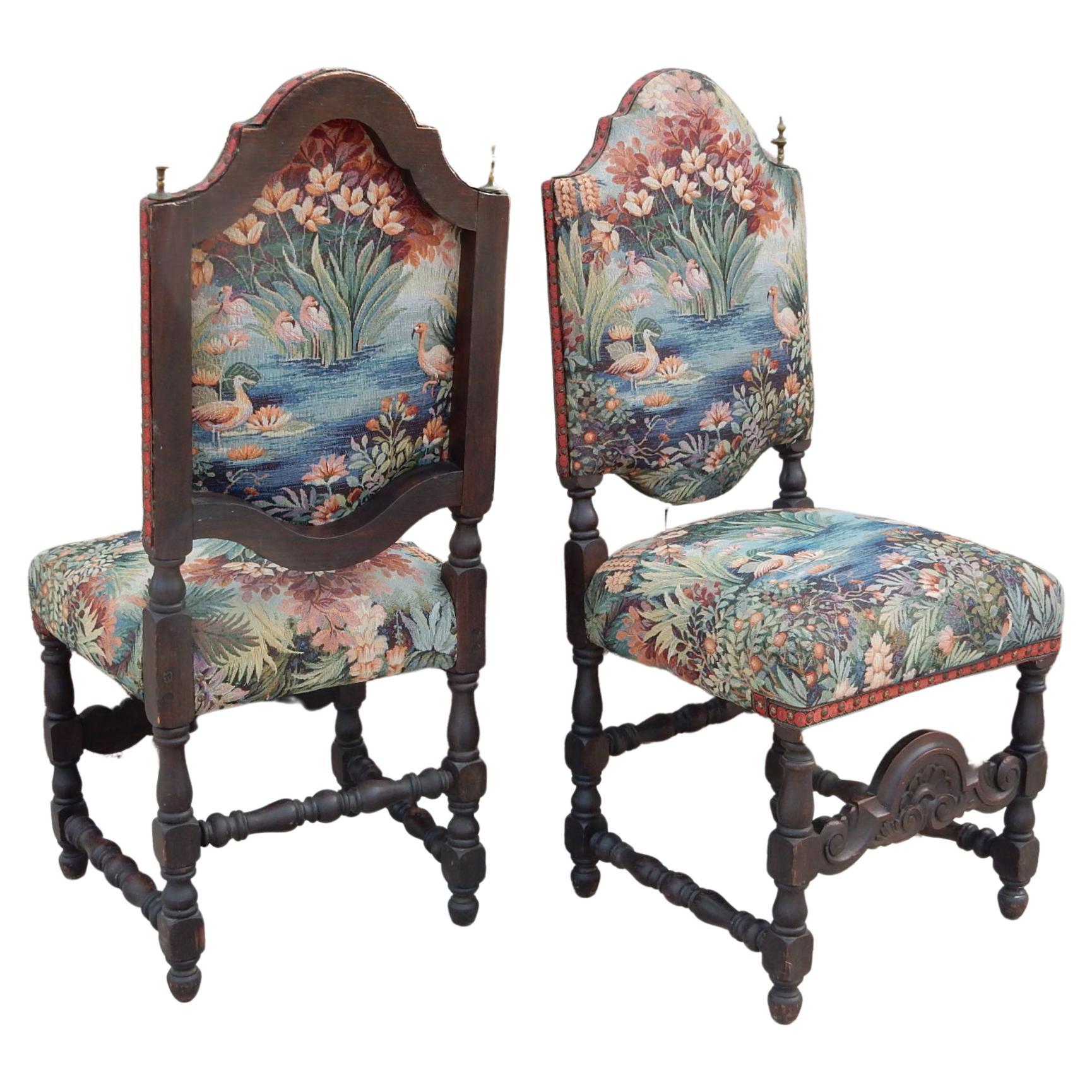 Soulful pair of Spanish Colonial Revival side chairs upholstered in
a gorgeous flamingo garden paradise upholstery. Circa 1940's frames.
Large brass finals on each side with fancy trim and nailhead edges.
Upholstery is very clean with no stains,