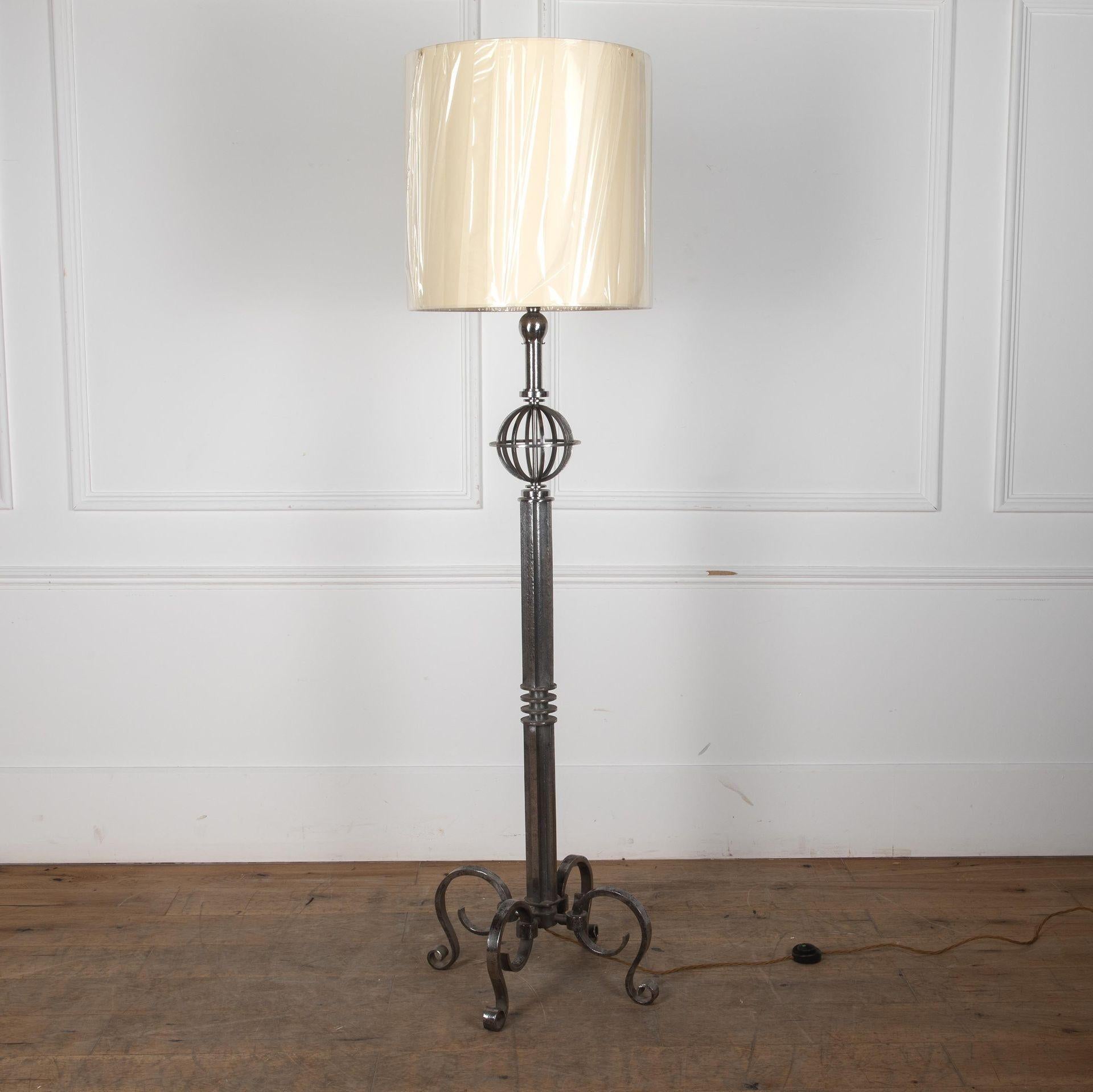 1940s French Modernist iron lamp stand, fashioned as a column with multiple ribs and collars.
Standing on a tripod of scroll legs and surmounted by a stylised globe with a ribbed cup above.
Attributed to Gilbert Poillerat.
PAT tested and wired to UK
