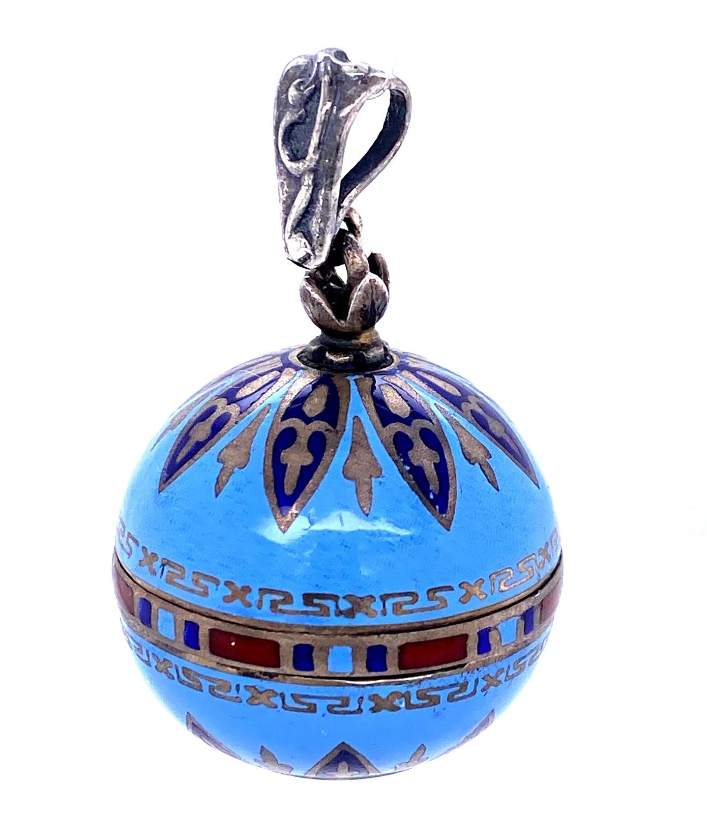 Sterling Silver and enamel mechanical watch that hangs 1 ⅜ ’’ long, with the ball being ⅞’’ of that being the ball. 