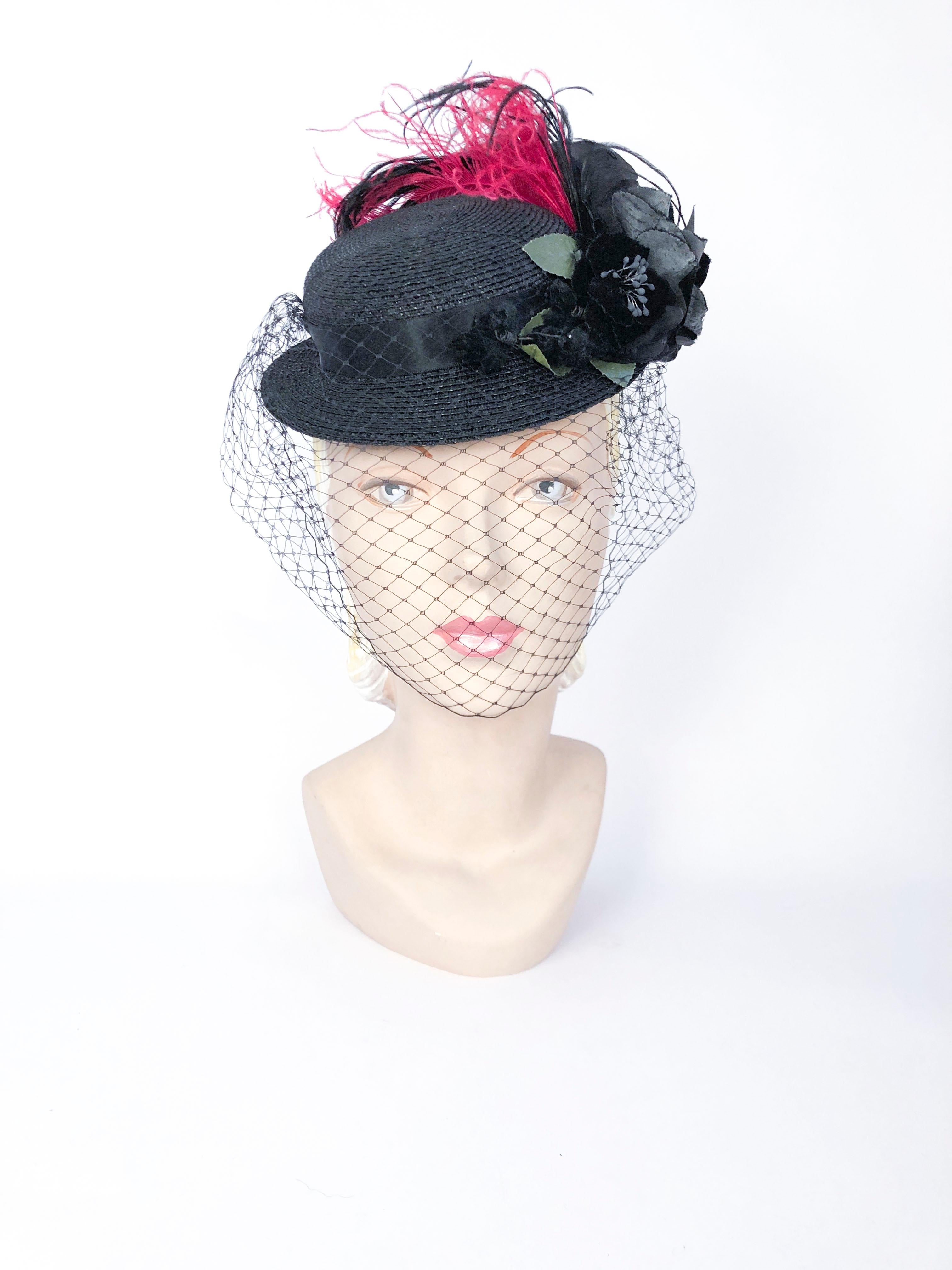 1940s Straw Toy Hat with Multi-colored Feathers (magenta and black), silk hand-cut flowers and Full Veil. Elastic is attached to further secure the hat to the head.