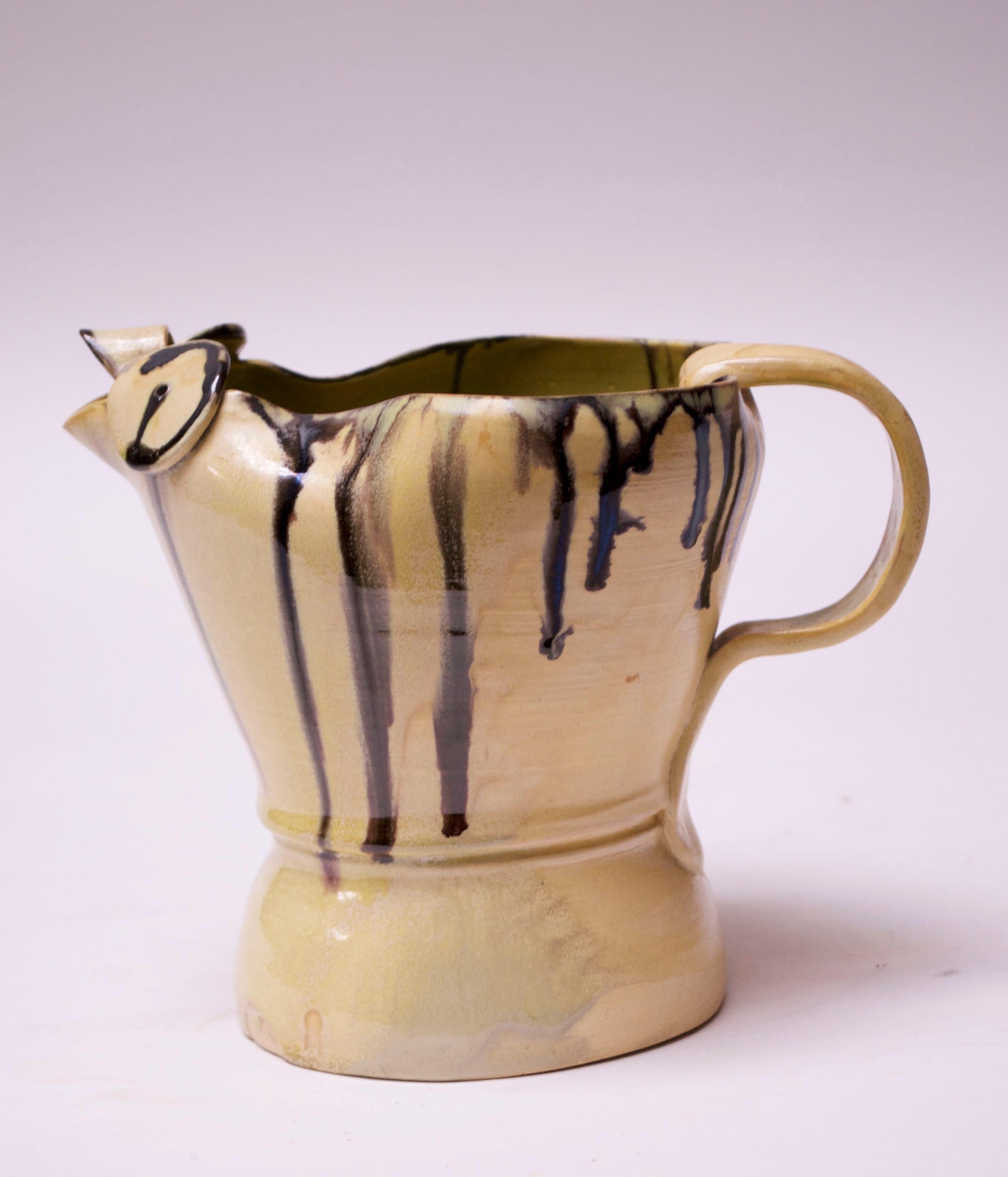 1947 studio pottery chicken pitcher / decorative object by ceramicist and former art professor, Emily Reinse. Flaxen-yellow glaze with drip-applied dark brown (almost black in appearance) linear details. Interior offers a pop of color in chartreuse.