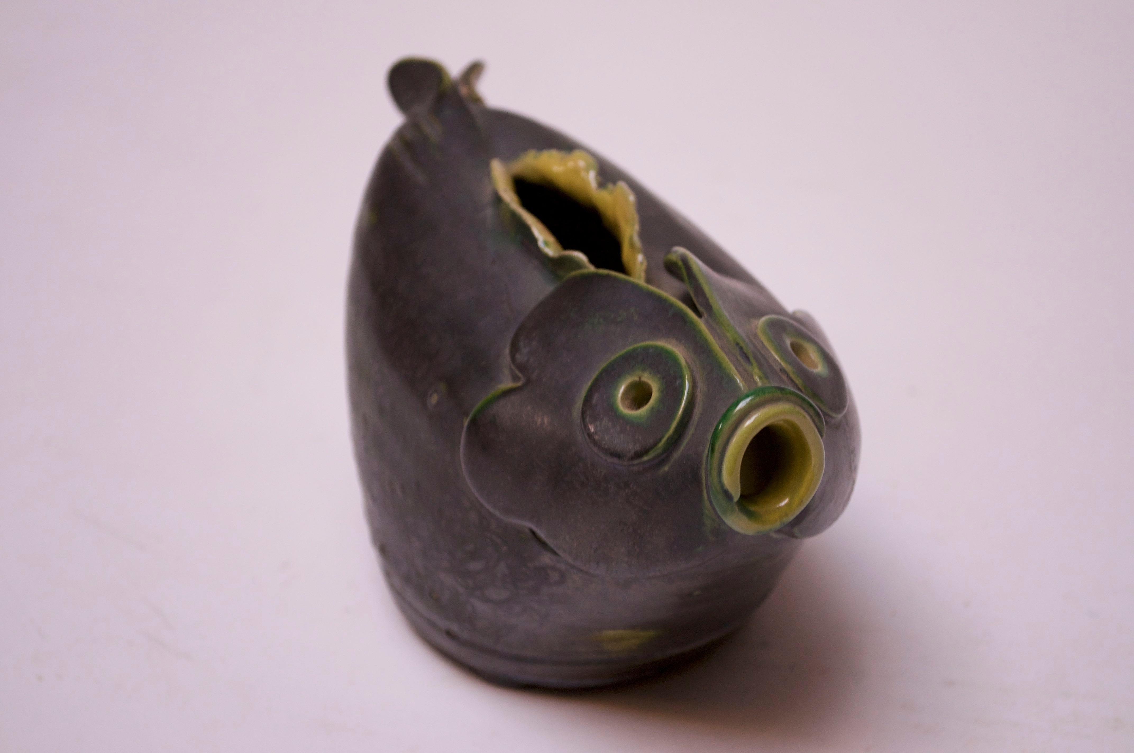 Late 1940s Studio Pottery fish pitcher / decorative object by ceramicist and former art professor, Emily Reinse. Unique incorporation of textures / glazes with green and yellow hand painted decoration over an iron-gray metallic finish. This listing