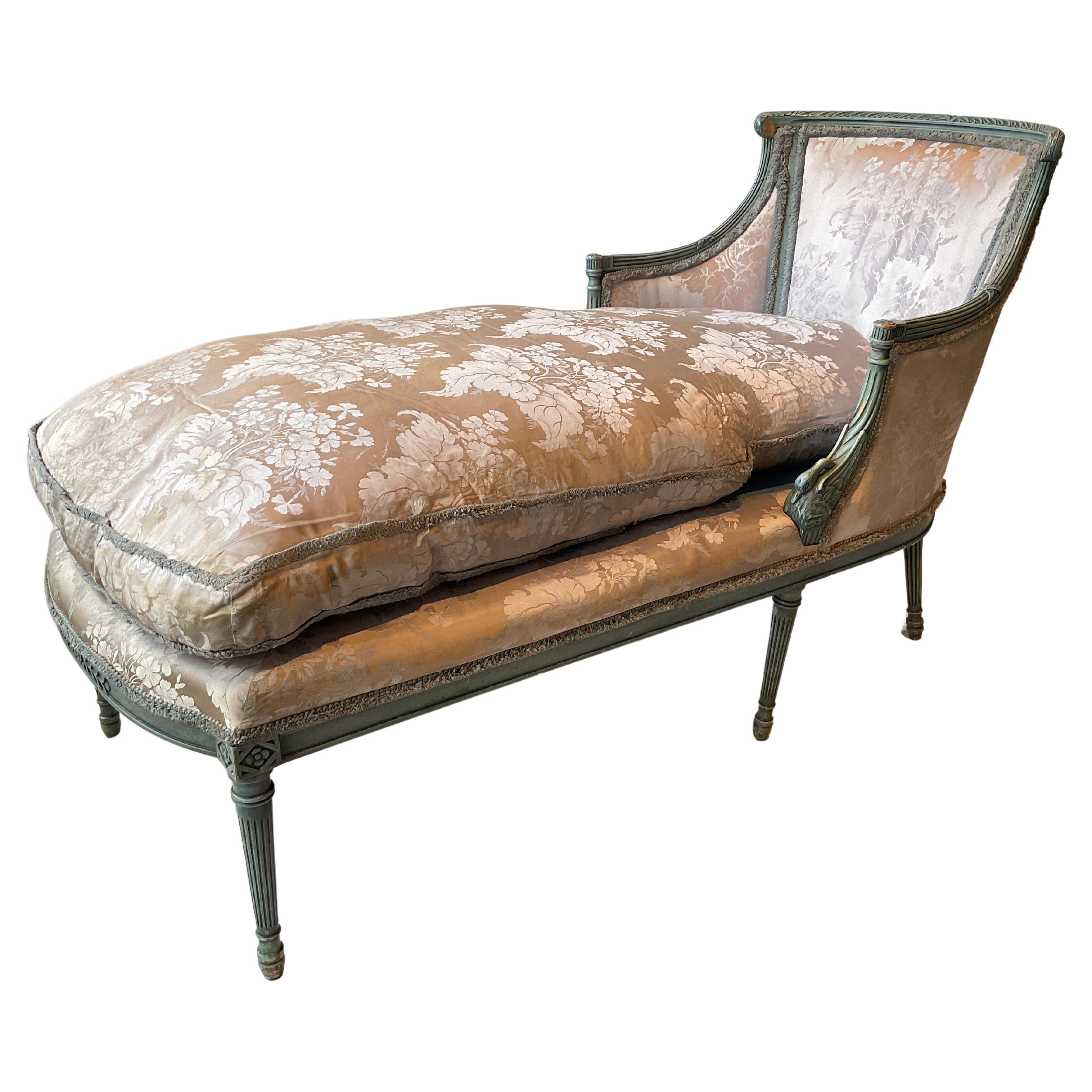 1940s French Carved wood swan chaise with down cushion. Needs reupholstering. Missing 2 florets on top as shown in picture. Middle 2 legs lean in ( that’s how the chaise was made ).
