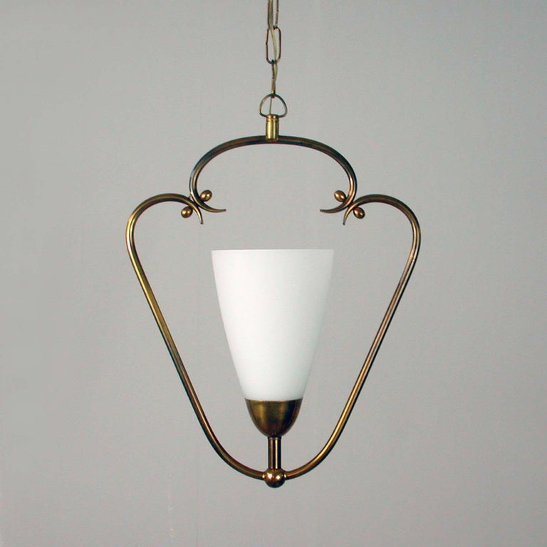 This vintage brass and frosted glass pendant was designed and manufactured in Sweden in the 1940s.
Very fine condition with a beautiful patina of age on the brass. No damage to the glass diffuser.

One E14 socket with new wiring. Can be worked in