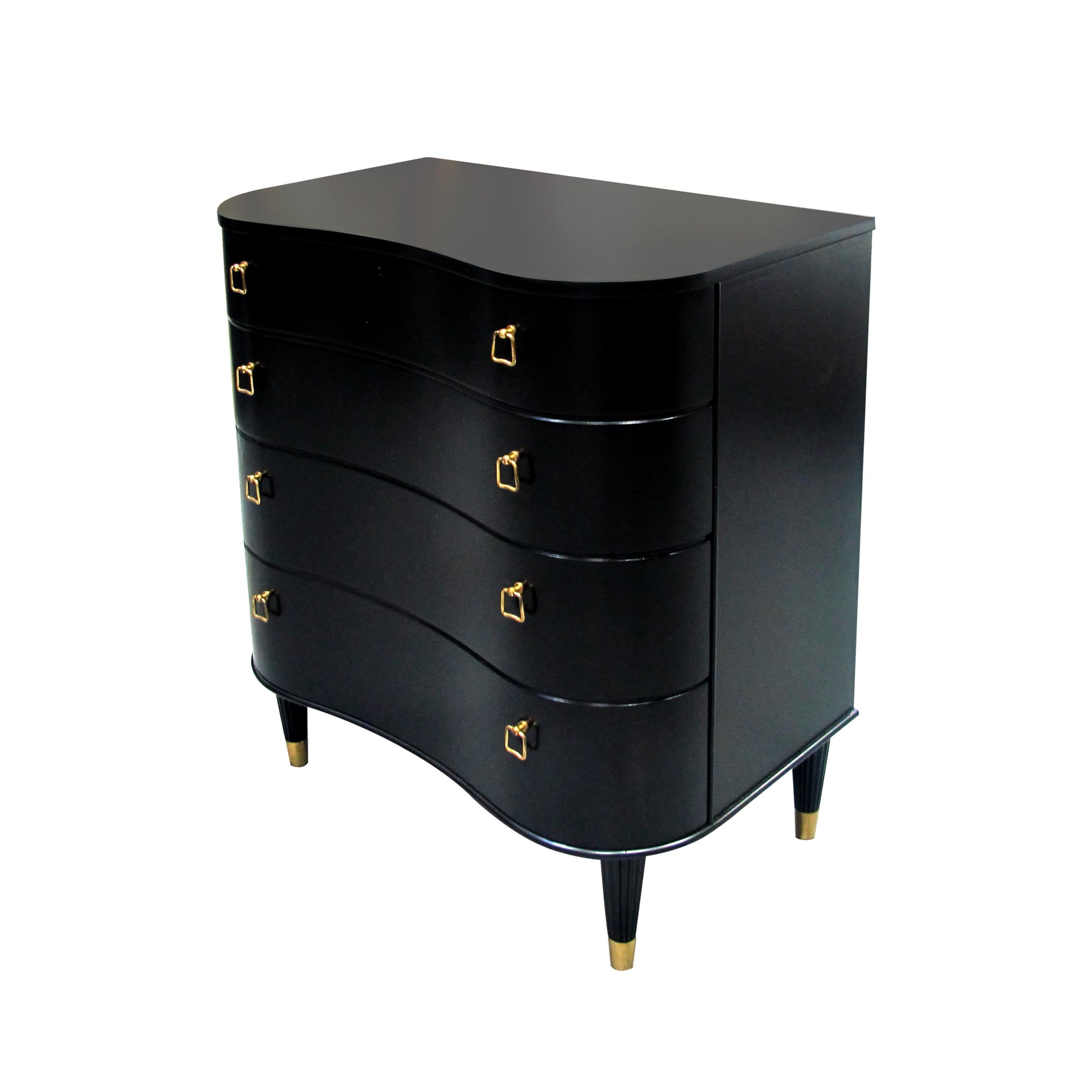 A very well-made and elegant curved fronted chest of drawers with four drawers and brass handles. The chest of drawers is attributed to Swedish furniture designer Axel Larsson. The top drawer holds the lock mechanism to lock/unlock the four drawers.