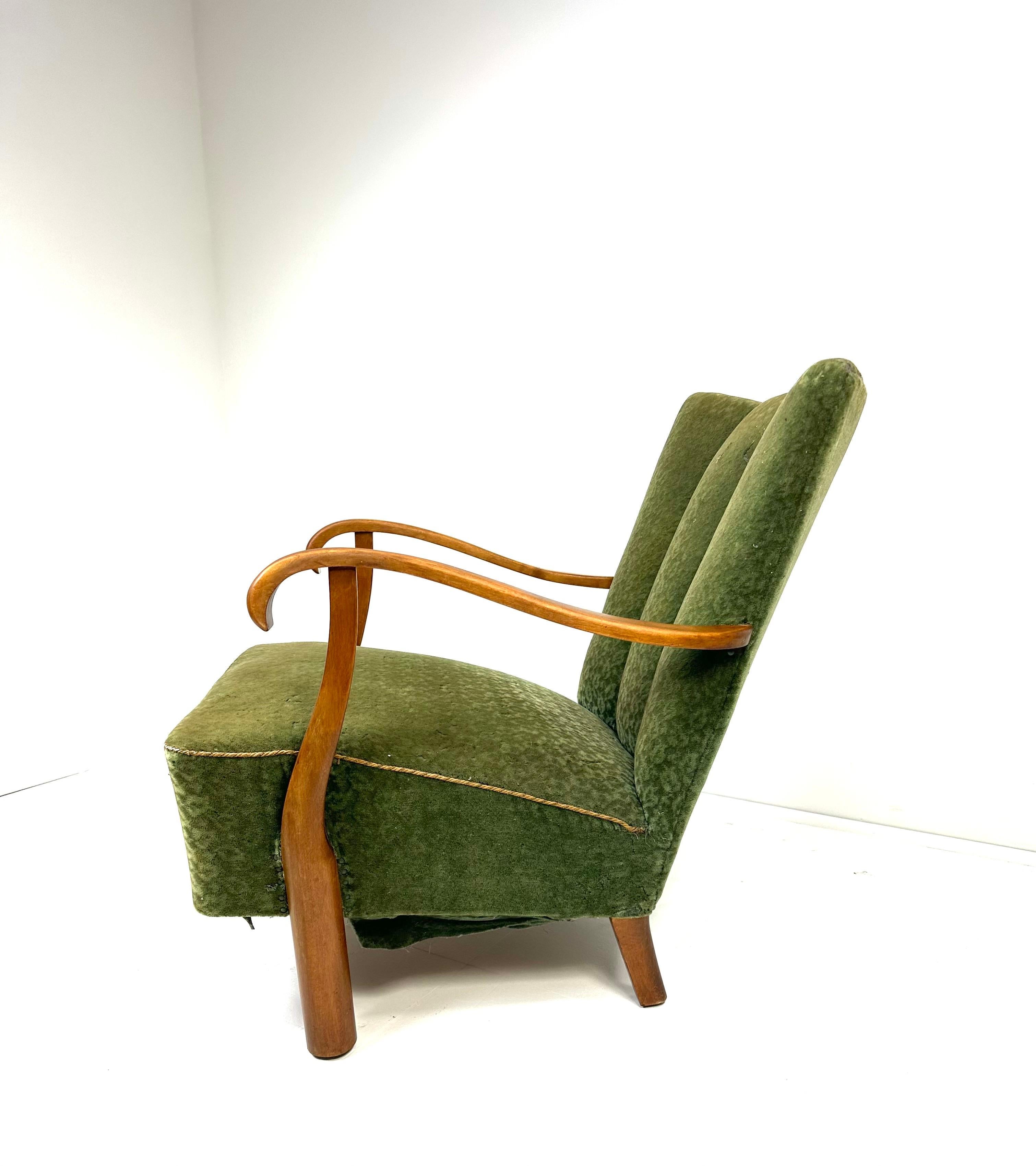 1940’s Swedish Lounge Chair. Elegantly sculpted Birch wood frame. Original upholstery.