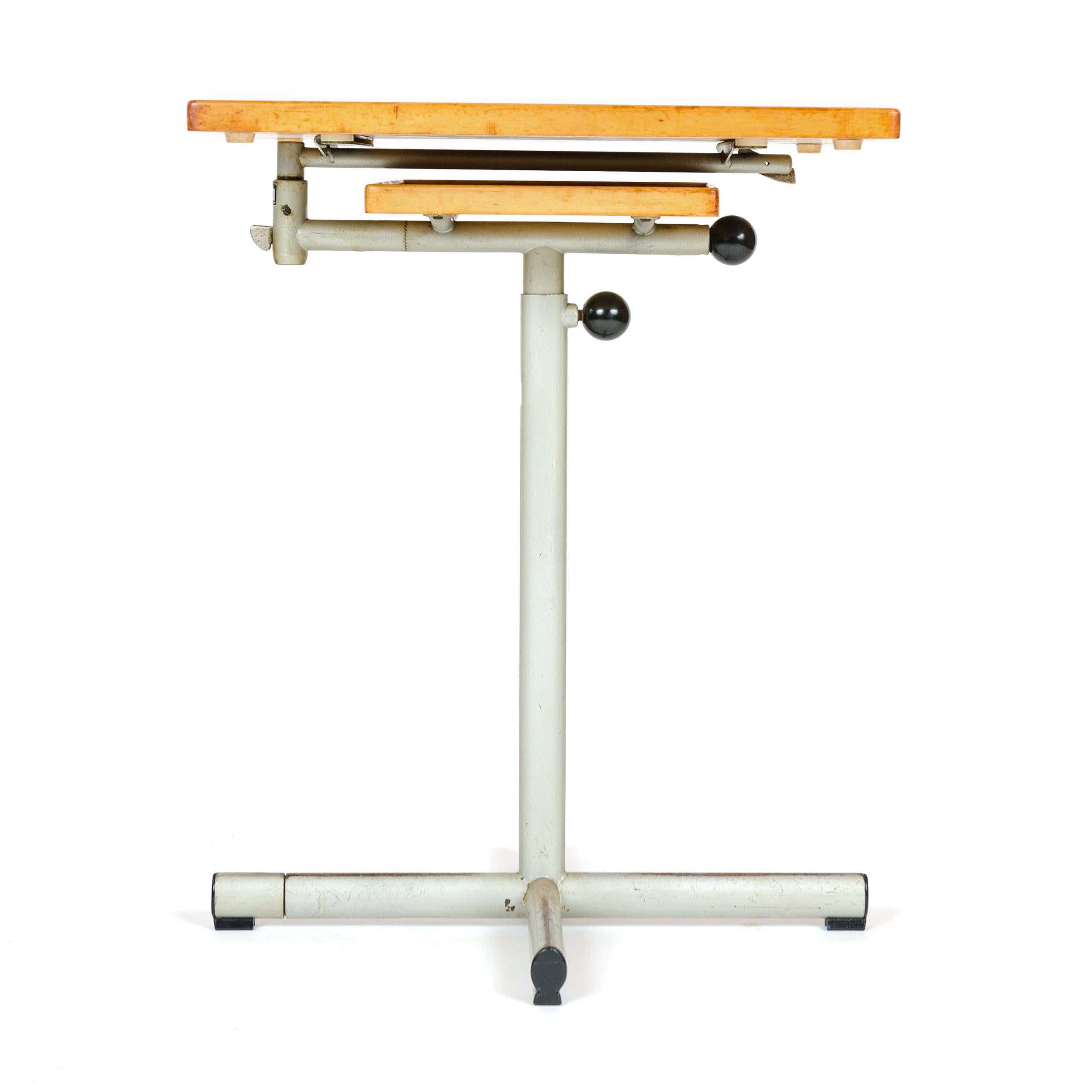 A beautifully engineered utility tray table or workstation with a copper plated steel base and a bakelite handle. The upper surface swings around has a 90º tilt and adjusts to 26