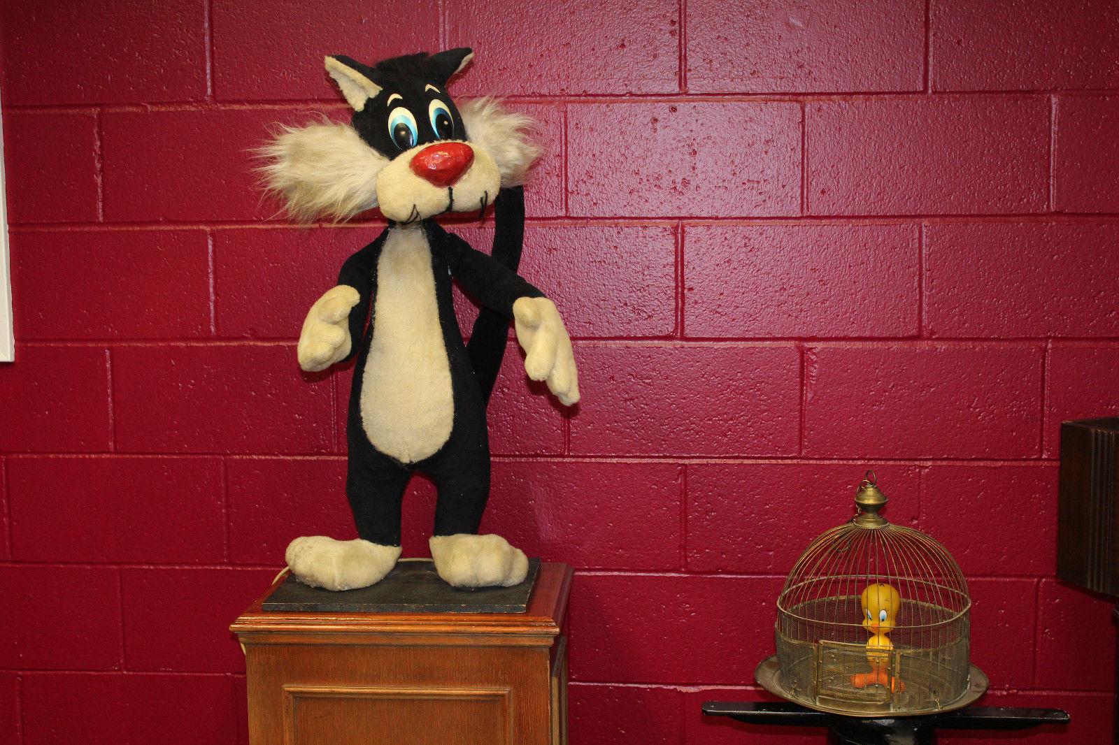 Vintage rare moving plush toy, in good condition. Believed to have been made for a department store window display. Sylvester is mechanical and moves his head side to side as well as his hands up and down. This piece came out of a high end