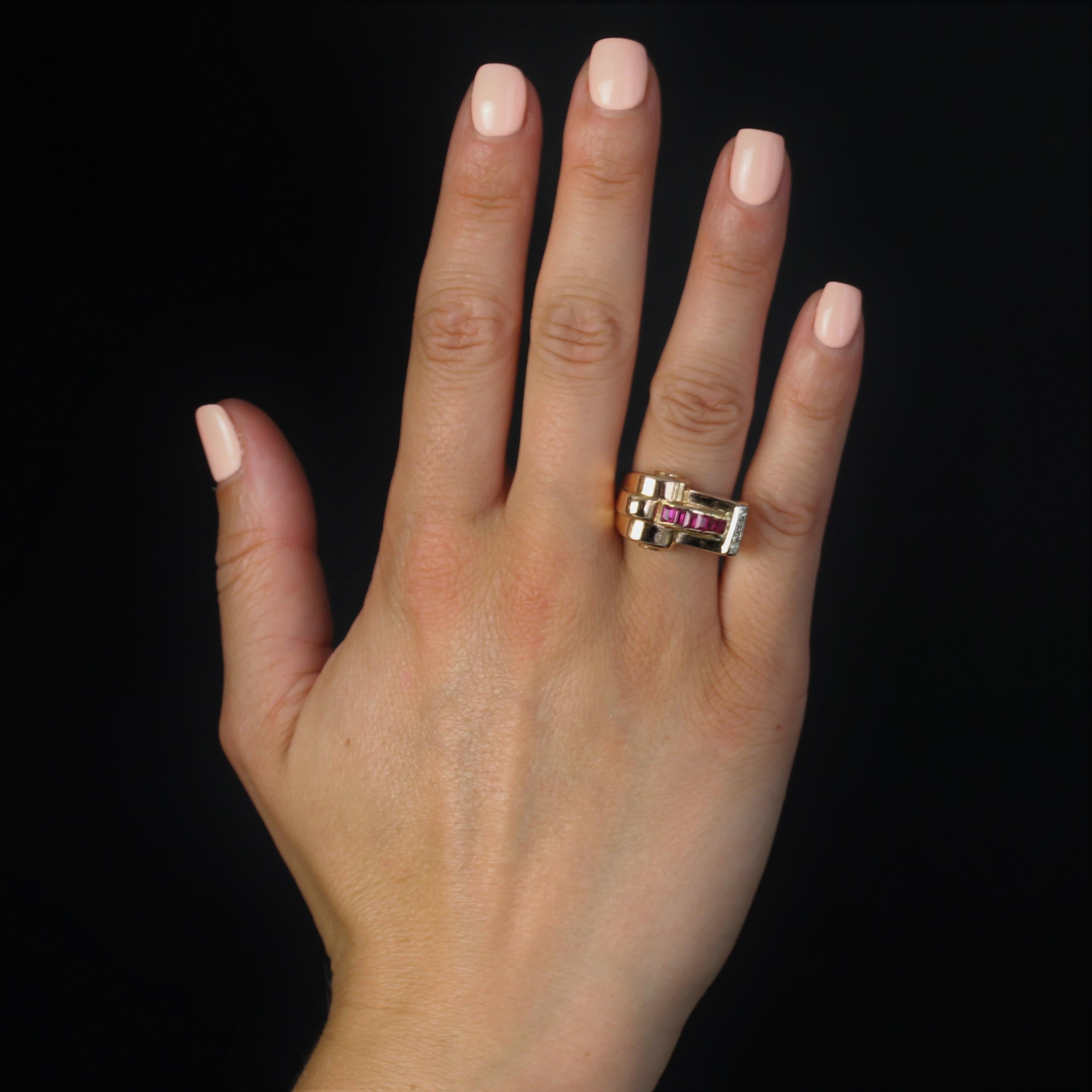 Ring in 18 karat rose gold.
This asymmetrical tank ring features a scrolled design and is set at the top with a line of rail-set calibrated synthetic rubies. The other end of the plate is adorned with a line of 5 rose-cut diamonds.
Height : 13.5 mm