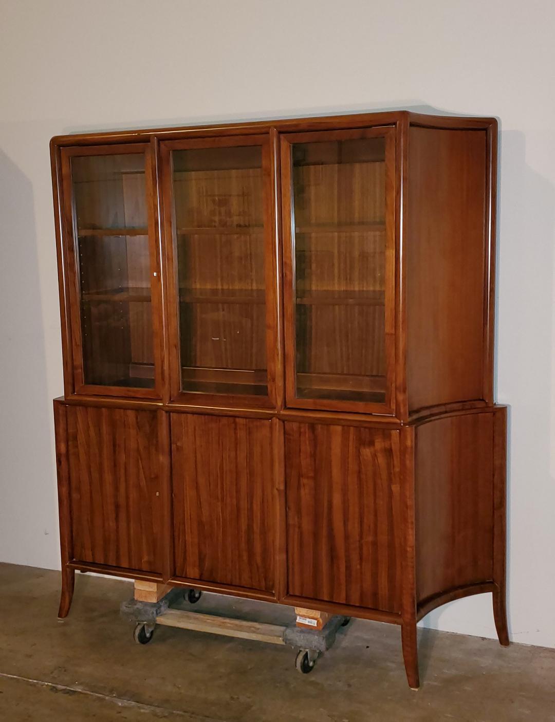 This T. H. Robsjohn Gibbings Is A Mahogany Bowed Front Credenza, With Tapered Sides, Sabered Legs, Glass Top Cabinet/Hutch, Brass/Bronze Pulls And Shelving Top And Bottom.

This Gorgeous Mahogany Cabinet Has Ample Storage Both Top And Bottom And Has