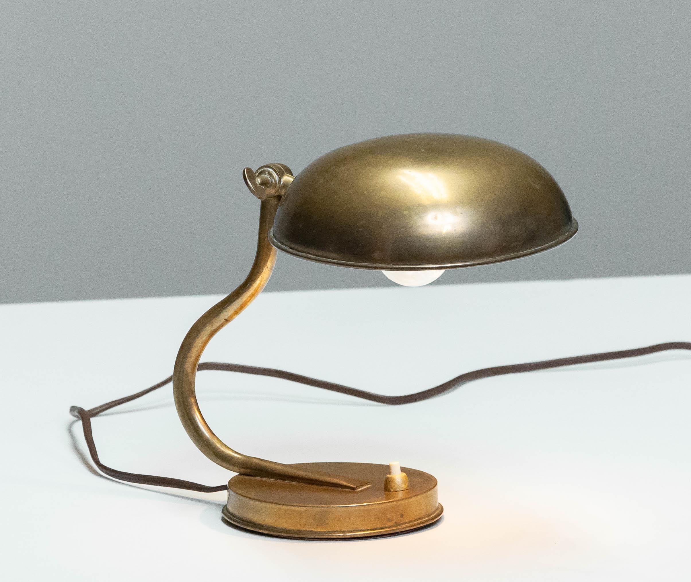 Beautiful and cute little table / desk lamp from the 1940s in brass made by ASEA in Sweden and attributed to designer Hans Bergström.
This table lamp is in good condition and technically 100%. 
One E27 / 28 screw fitting.
