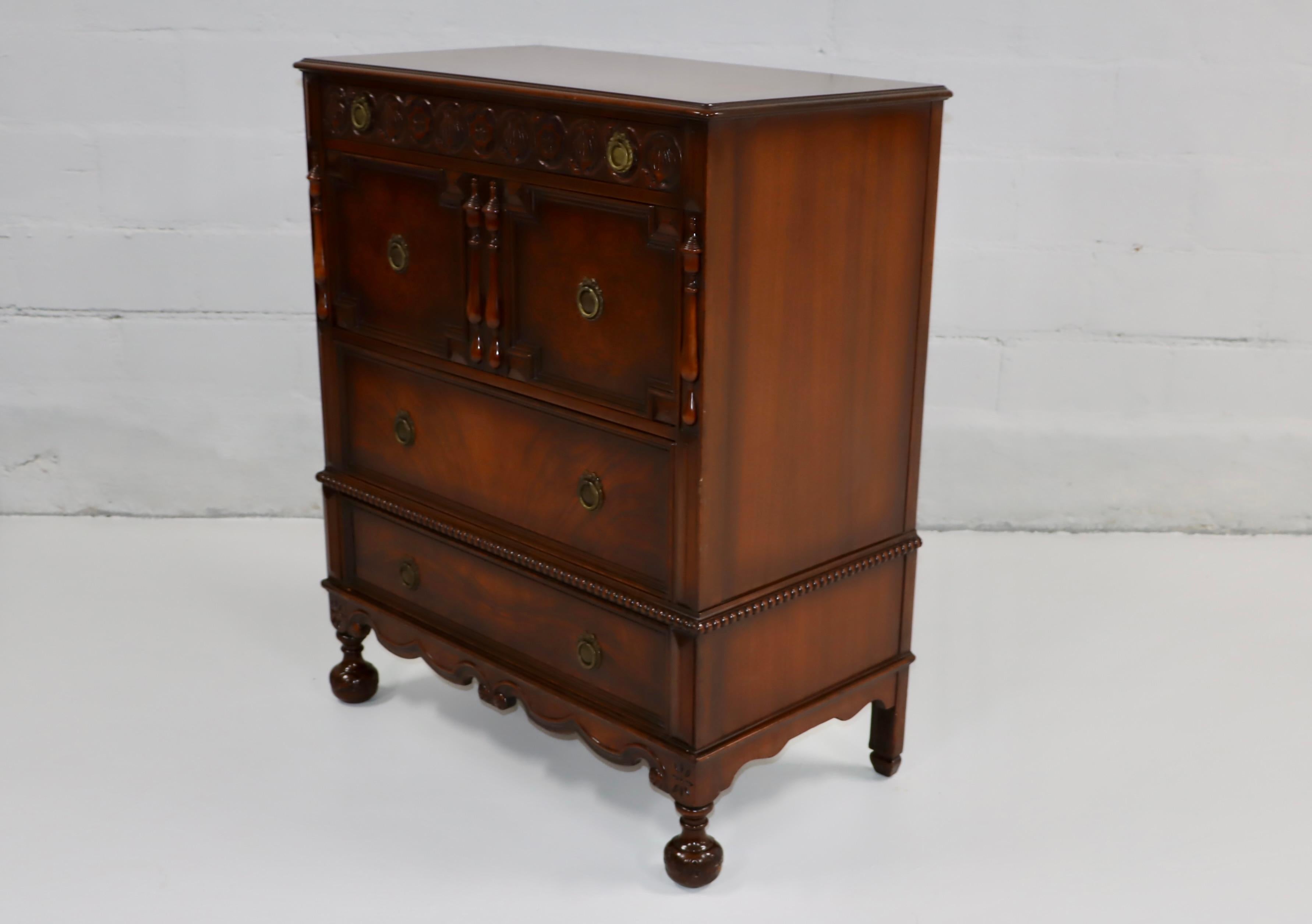 1940's walnut and mahogany 4 drawer dresser by Berkey & Gay Furniture, with beautiful carved wood detail and solid brass hardware, still retail the original jewelry tray and label, there is some wear and patina due to age and use. 