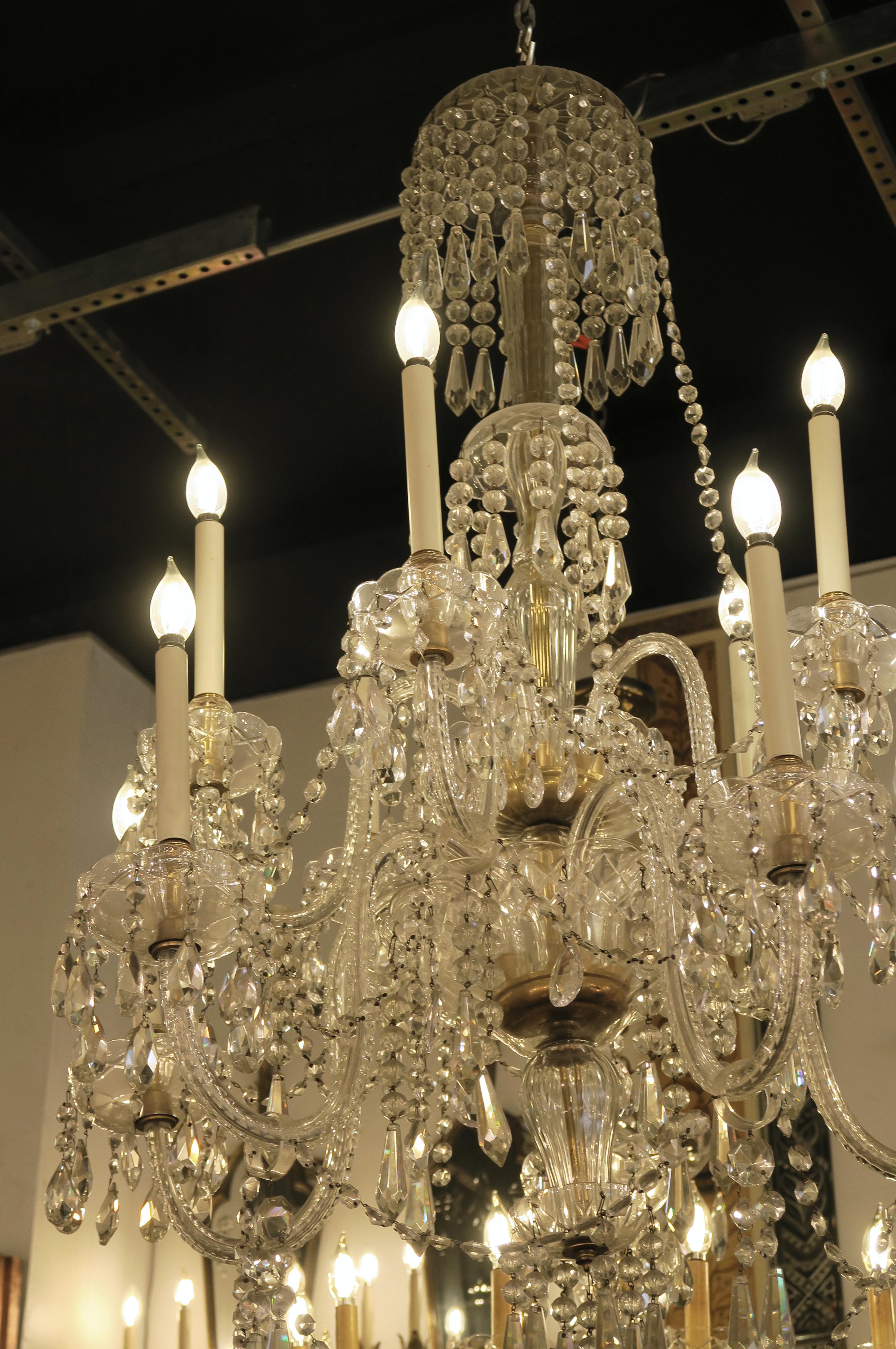 American 1940s Tall Eight Arm Crystal Chandelier with Brass Details