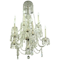 Lustre haut à huit bras en cristal des années 1940 avec détails en laiton