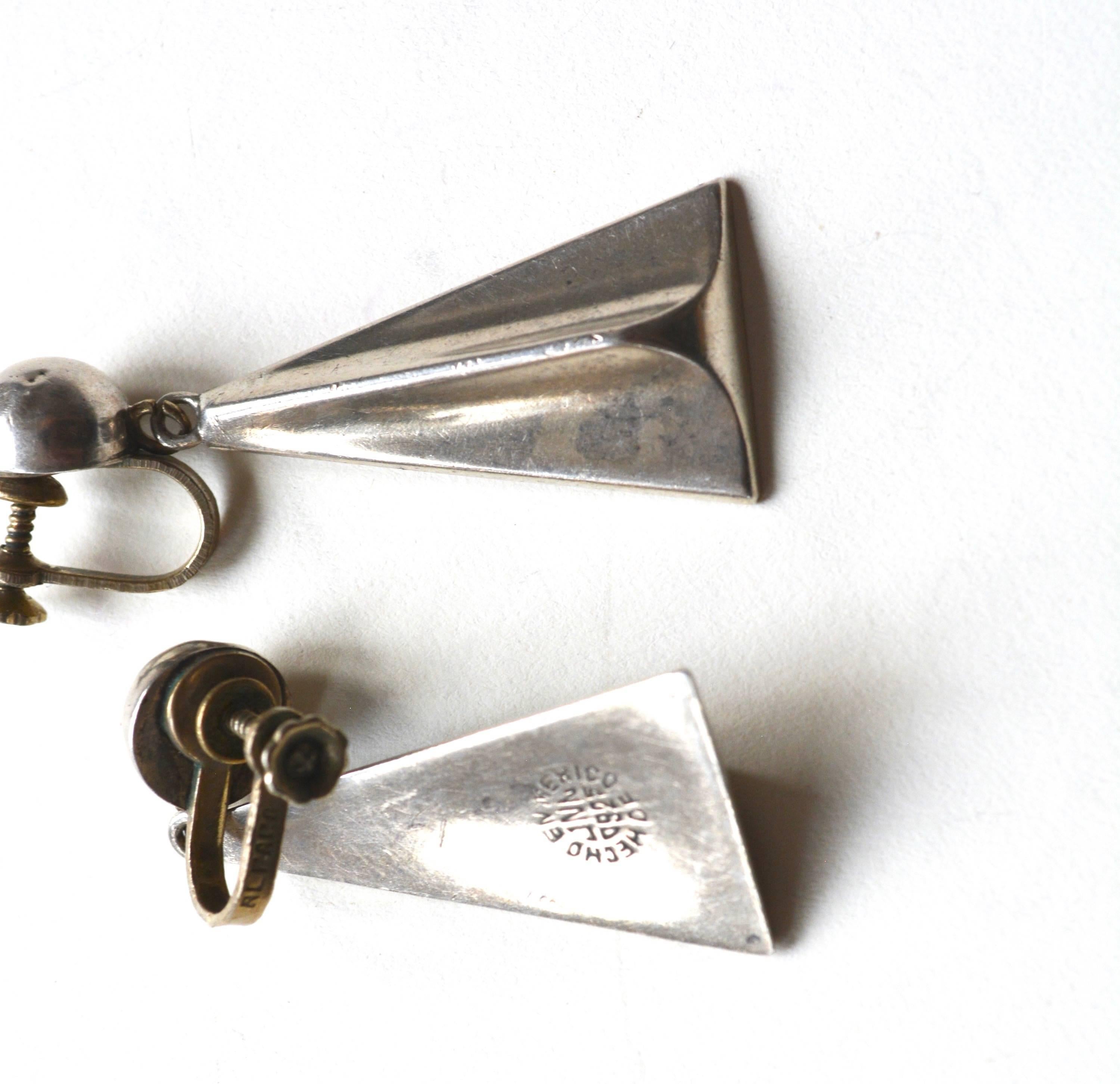 Sterling and Alpaca screw back earrings. Marked by the maker and stamped 925. The backs that screw in are marked Alpaca.  Great design, some wear. See images. 