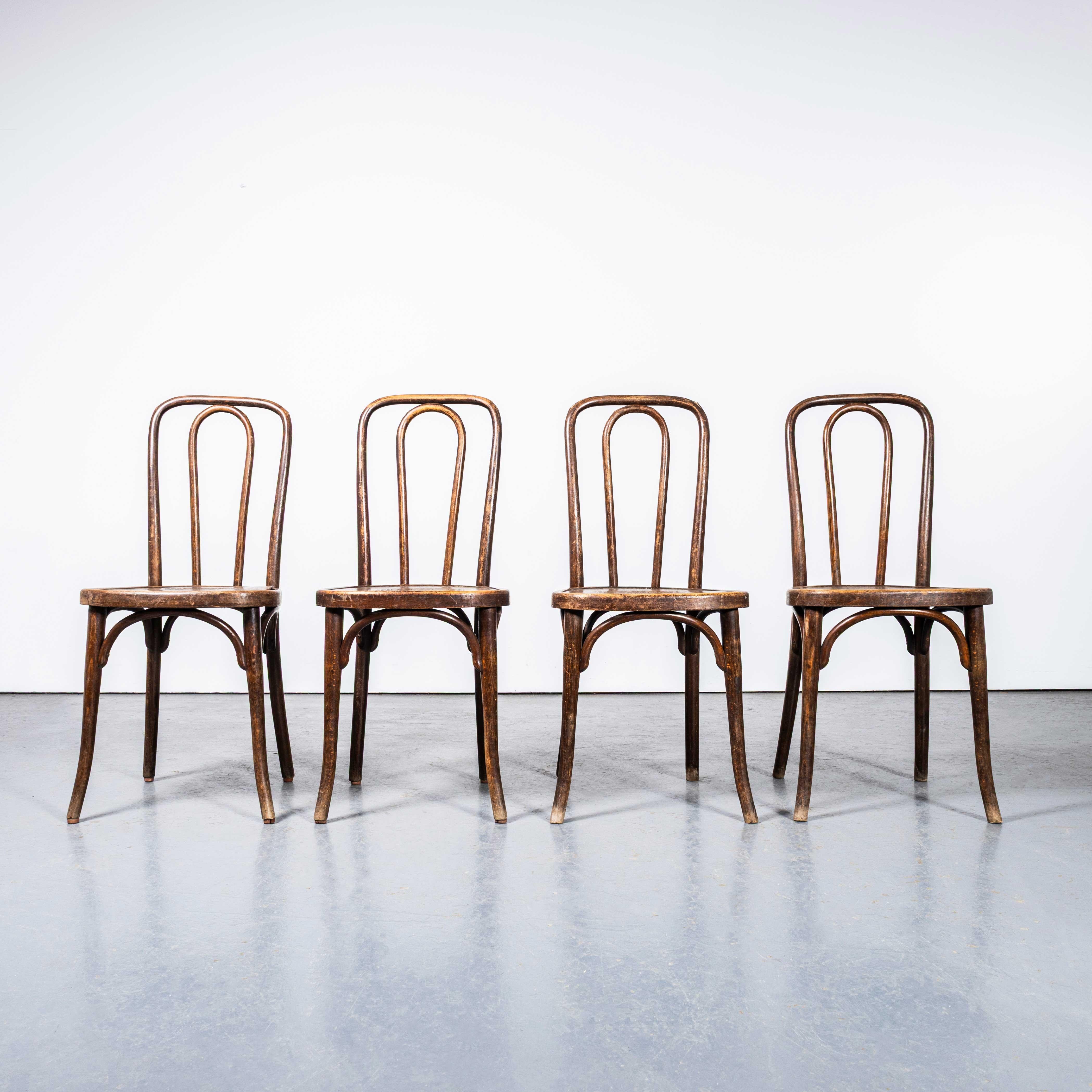 1940’s Thonet Original Square Hoop Back Bentwood Dining Chairs – Set Of Four. 
Founded in the early 19th Century by Michael Thonet, Thonet invented the process of steam bending wood under pressure and used this to design the classic bentwood chairs