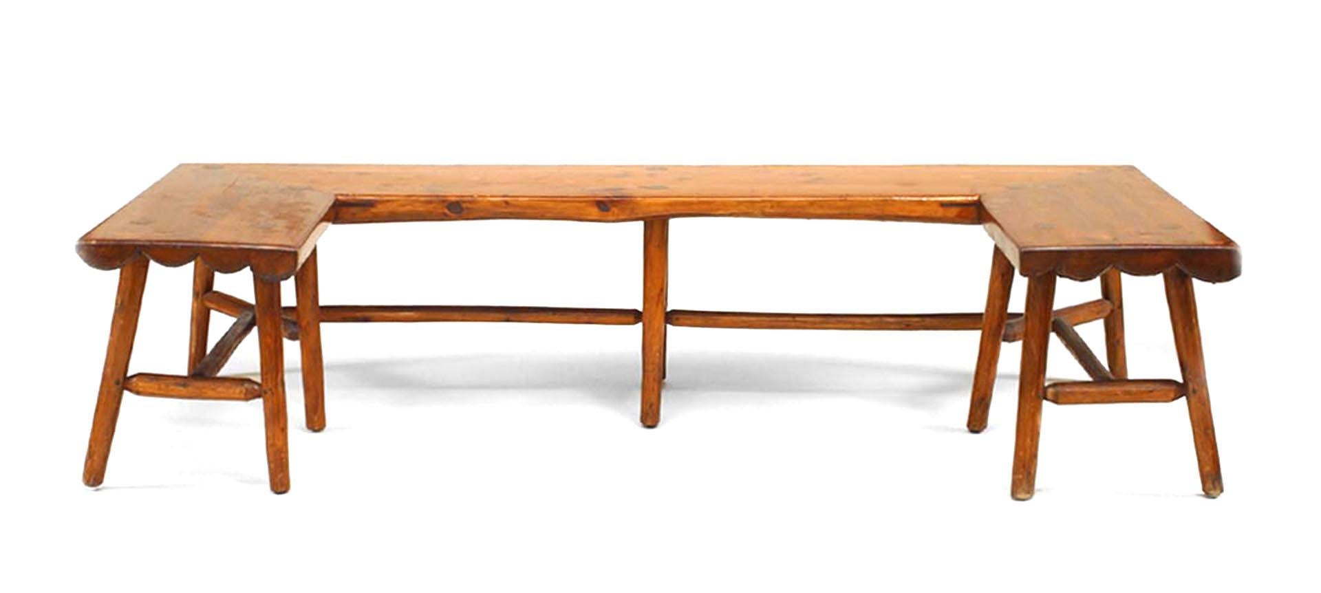 Bearing the brand of the Habitant Furniture Company of Michigan, this three-sided Old Hickory style hickory bench features a half timbered seat, stretcher, and scalloped edge front.