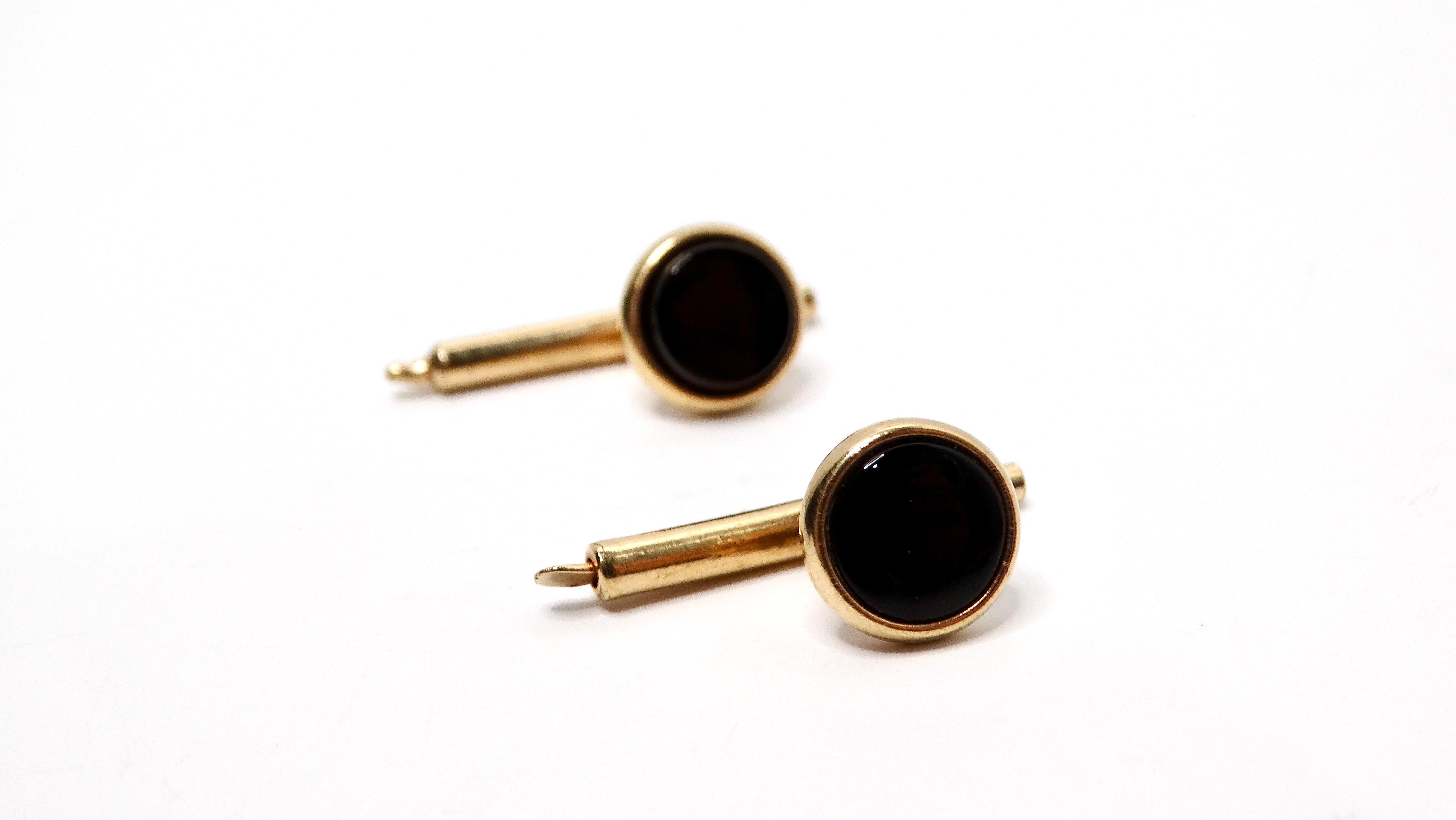 Introducing a stunning pair of 1940s Tiffany Inspired Onyx 14k Gold Plated Cufflinks, crafted with sophistication and elegance in mind. These cufflinks feature a striking circular onyx center surrounded by luxurious gold plating, bringing a timeless