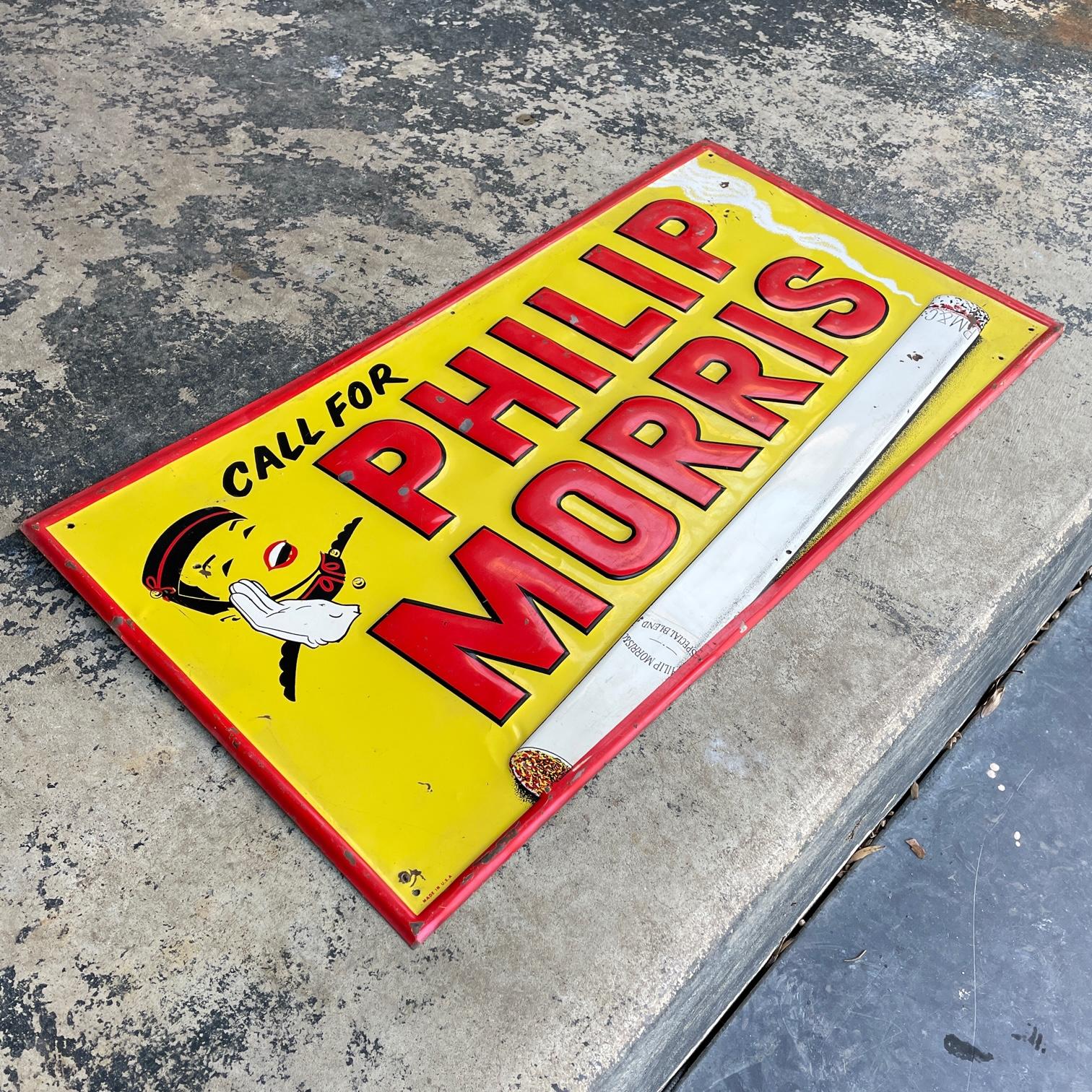Over two foot wide 'Tin Tacker' Sign. A brightly colored embossed metal 