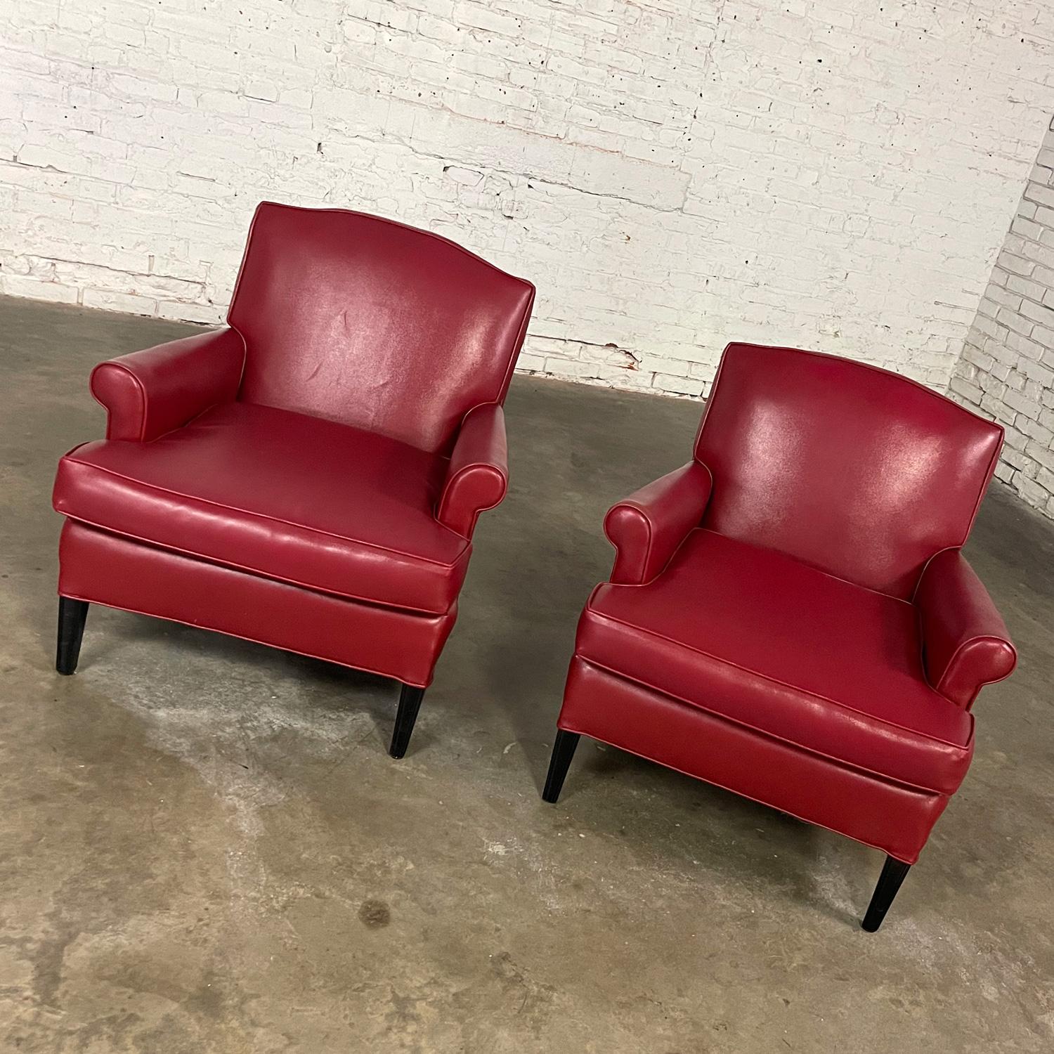 Gorgeous vintage Traditional club chairs with original faux leather or vinyl fabric and square tapered wood legs, a pair. Beautiful condition, keeping in mind that these are vintage and not new so will have signs of use and wear. The legs have been